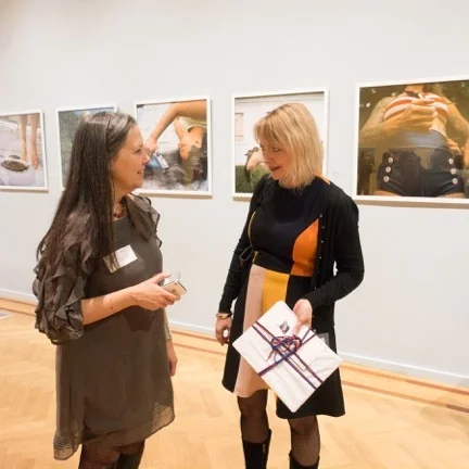 Photographer Nancy Grace Horton with the curator of the Newport Art Museum, Francine Weiss at the opening of the Domestic Affairs exhibit.