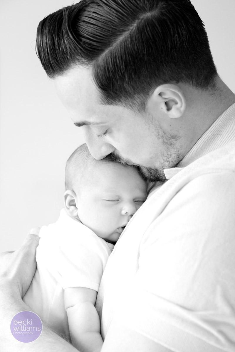 BABY PICS HEMEL HEMPSTEAD - dad cuddles baby boy - black and white
