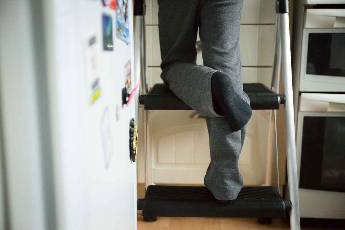 7 year old uses stool to reach counter top