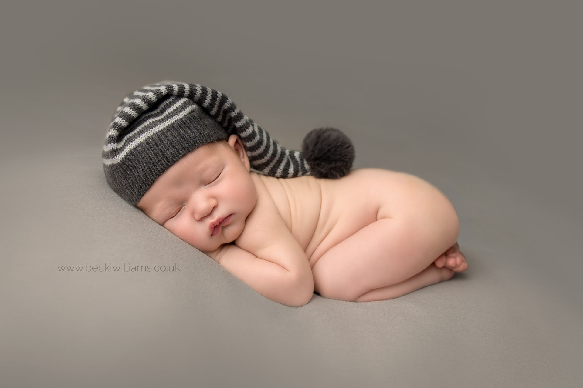 newborn-photography-hemel-hempstead-tummy-grey-asleep-hat