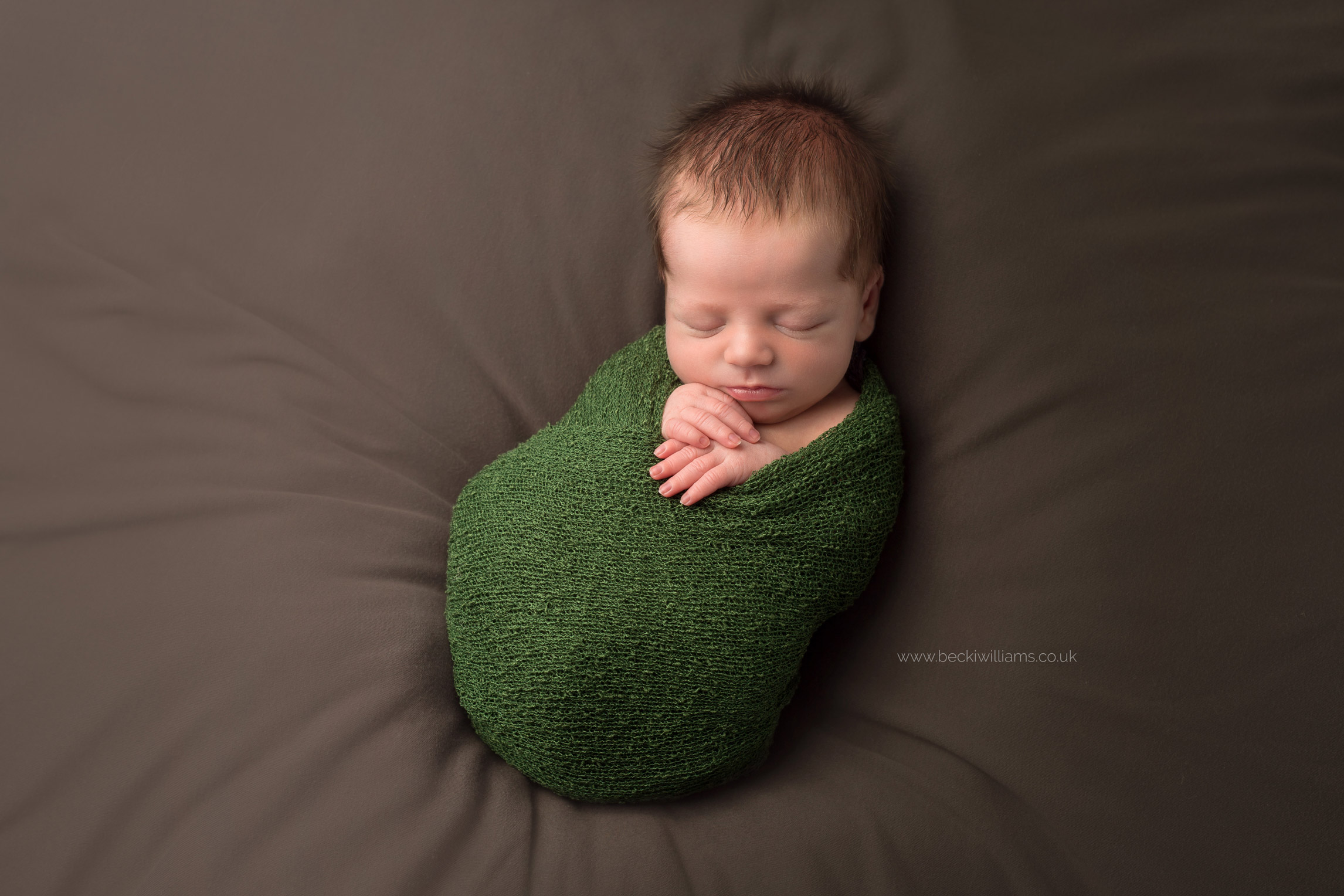 newborn-photography-st-albans-nature-green-brown-wrapped.jpg