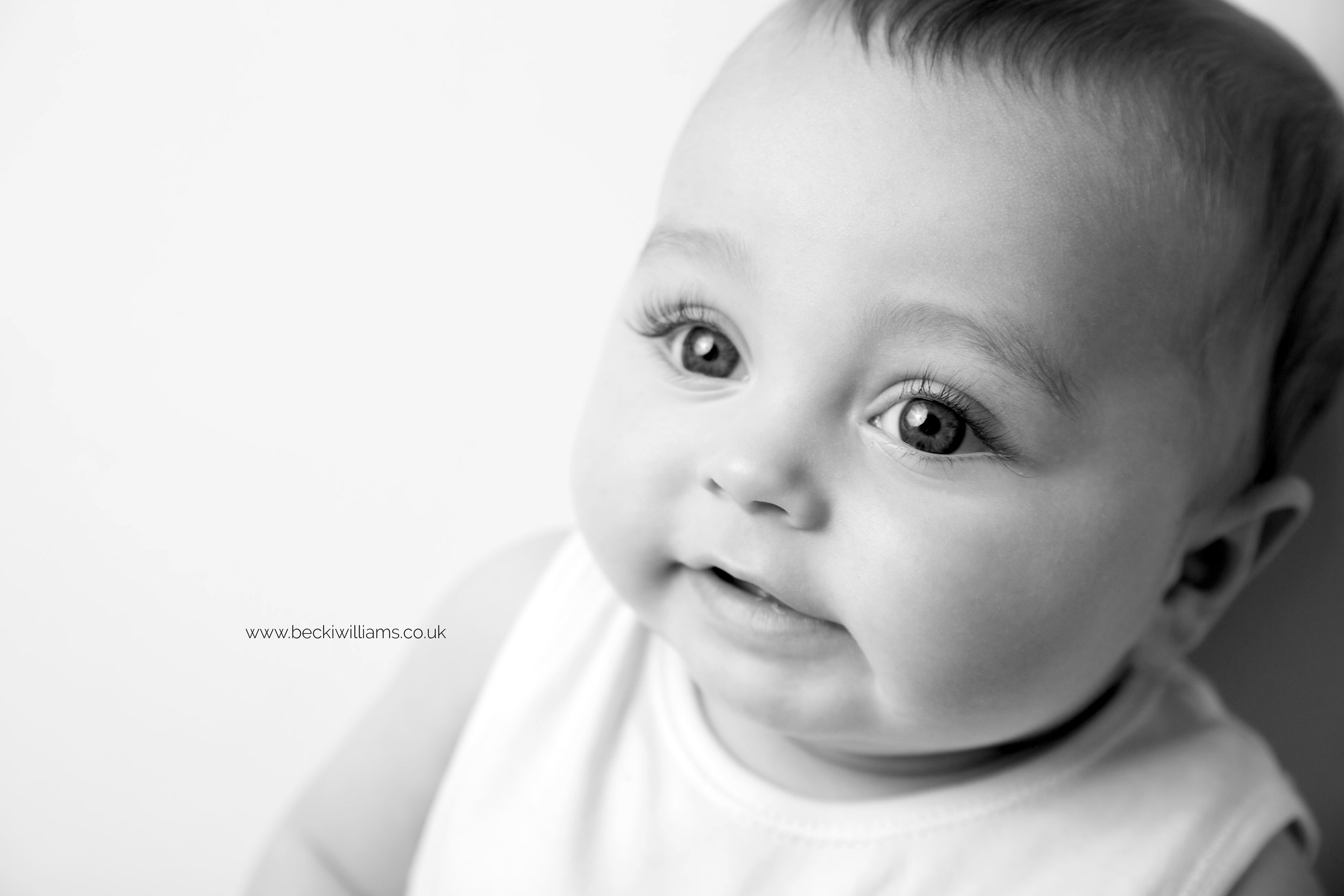 Close up of a 6 month old baby's face in black and white