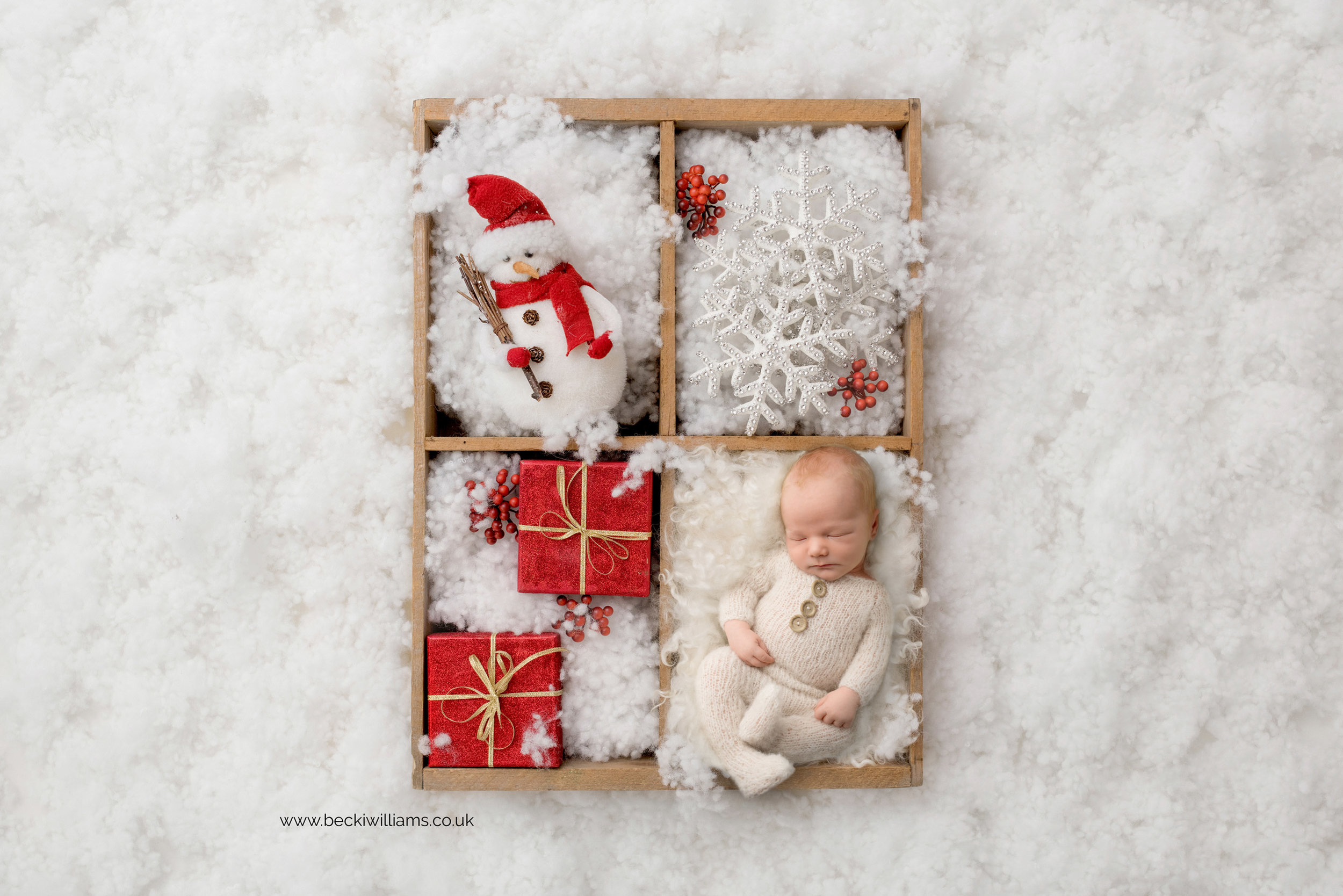 newborn-boy-portraits-hemel-hempstead-christmas-digital-background-snow-presents.jpg