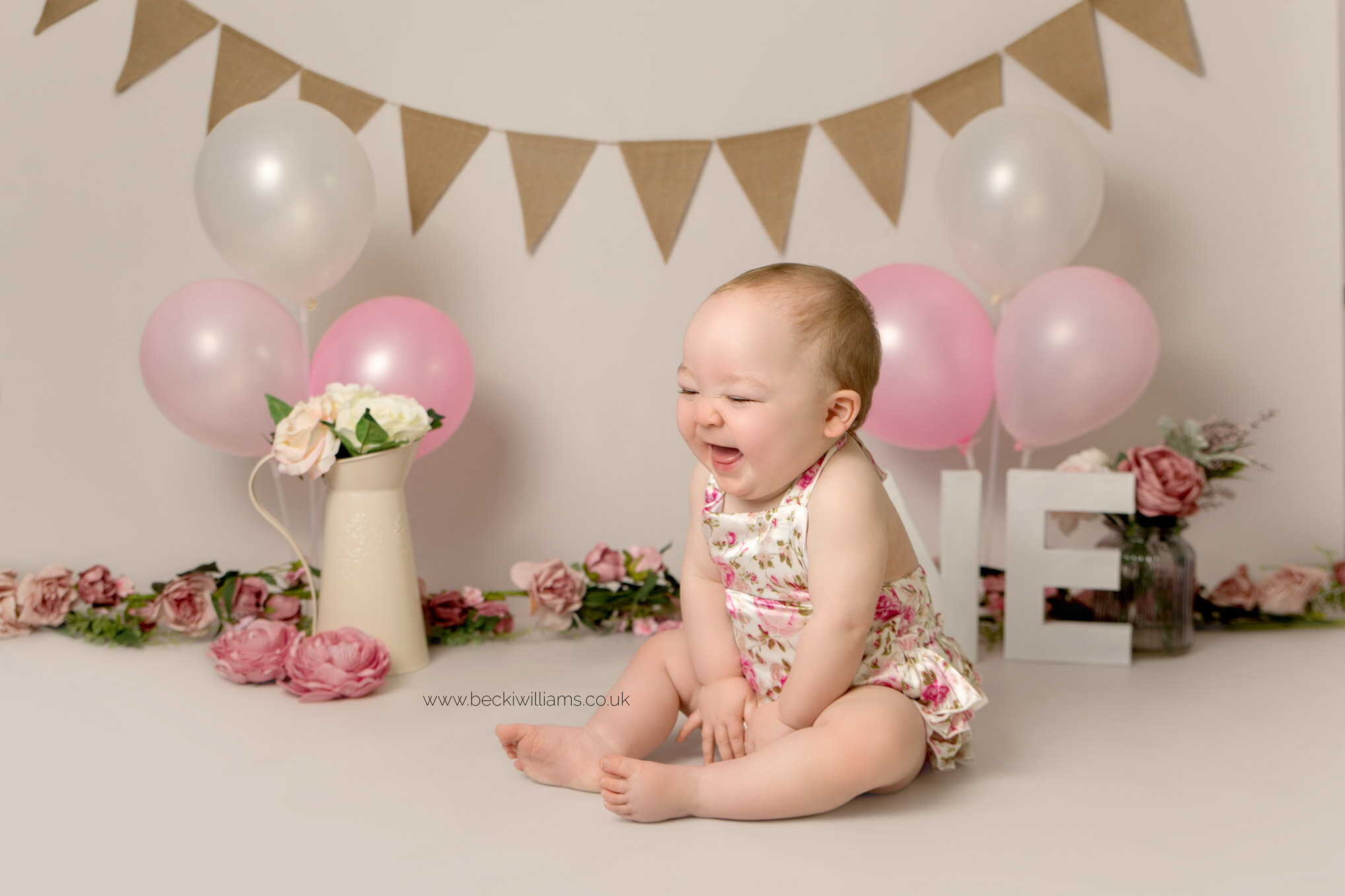 Pink floral first birthday photo shoot