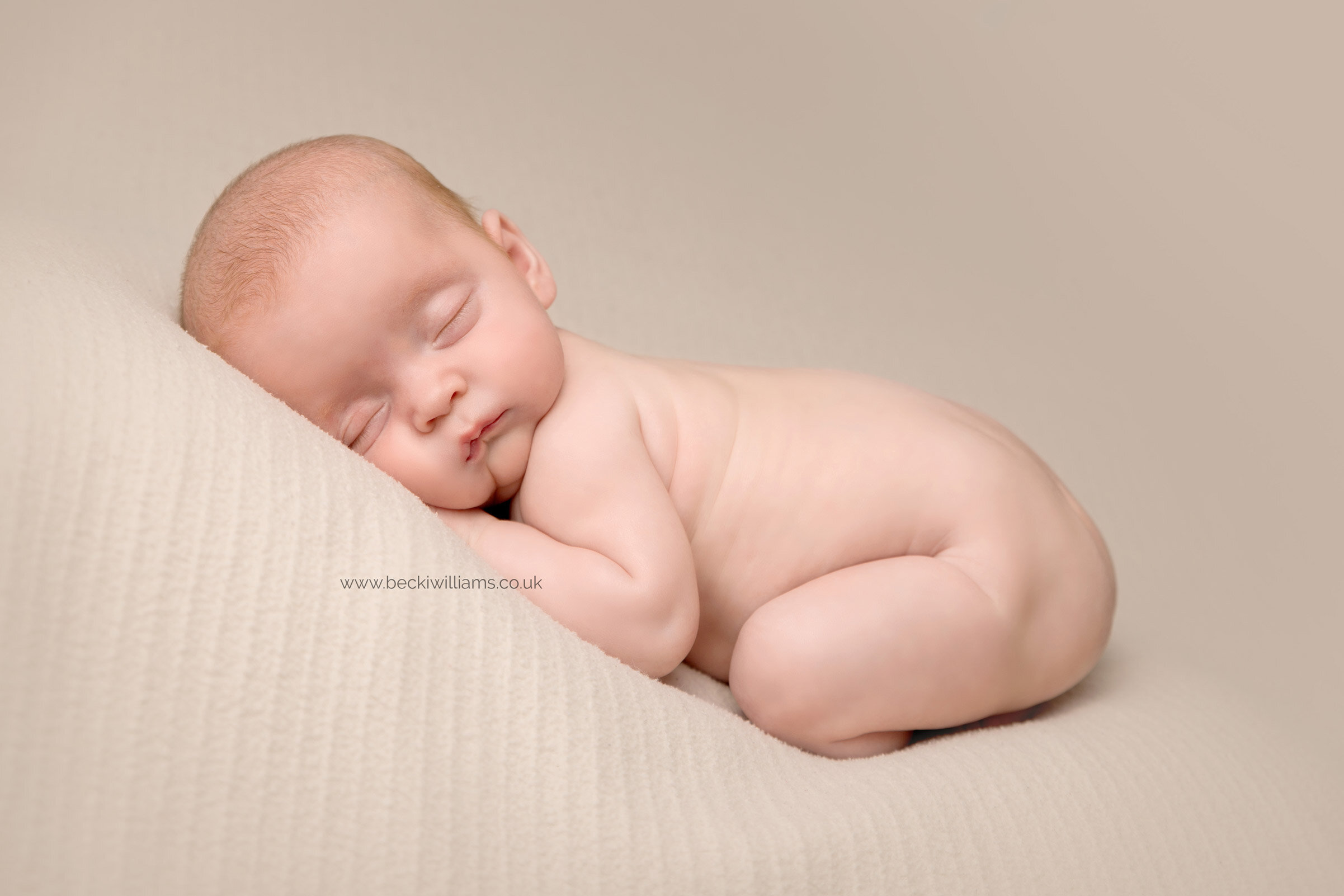 twin-newborn-photography-hemel-hempstead-tummy-curled-up-asleep.jpg