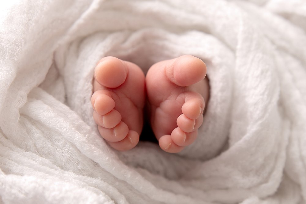 Close up photo of newborn baby's feet