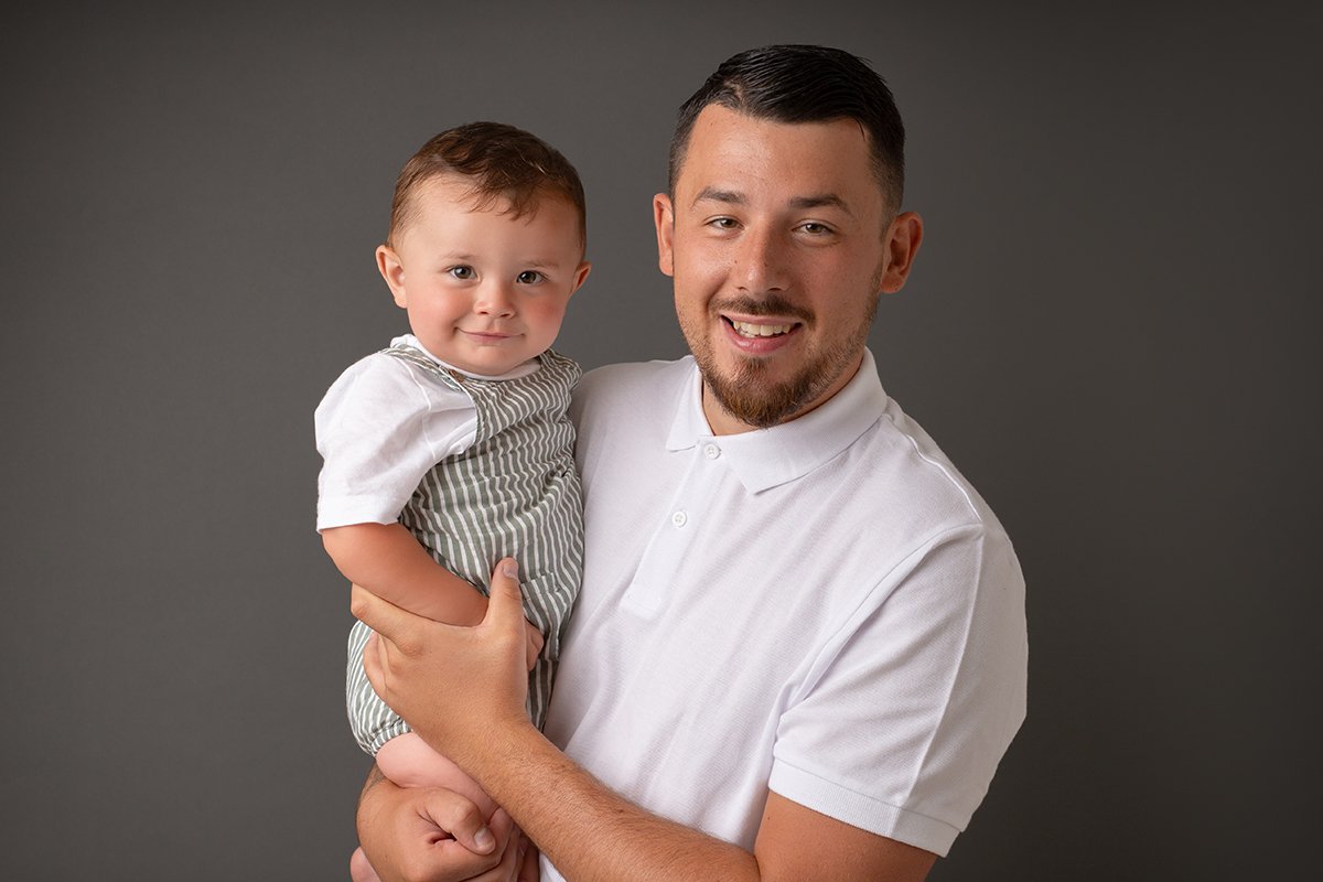 Dad holding his 1 year old baby boy