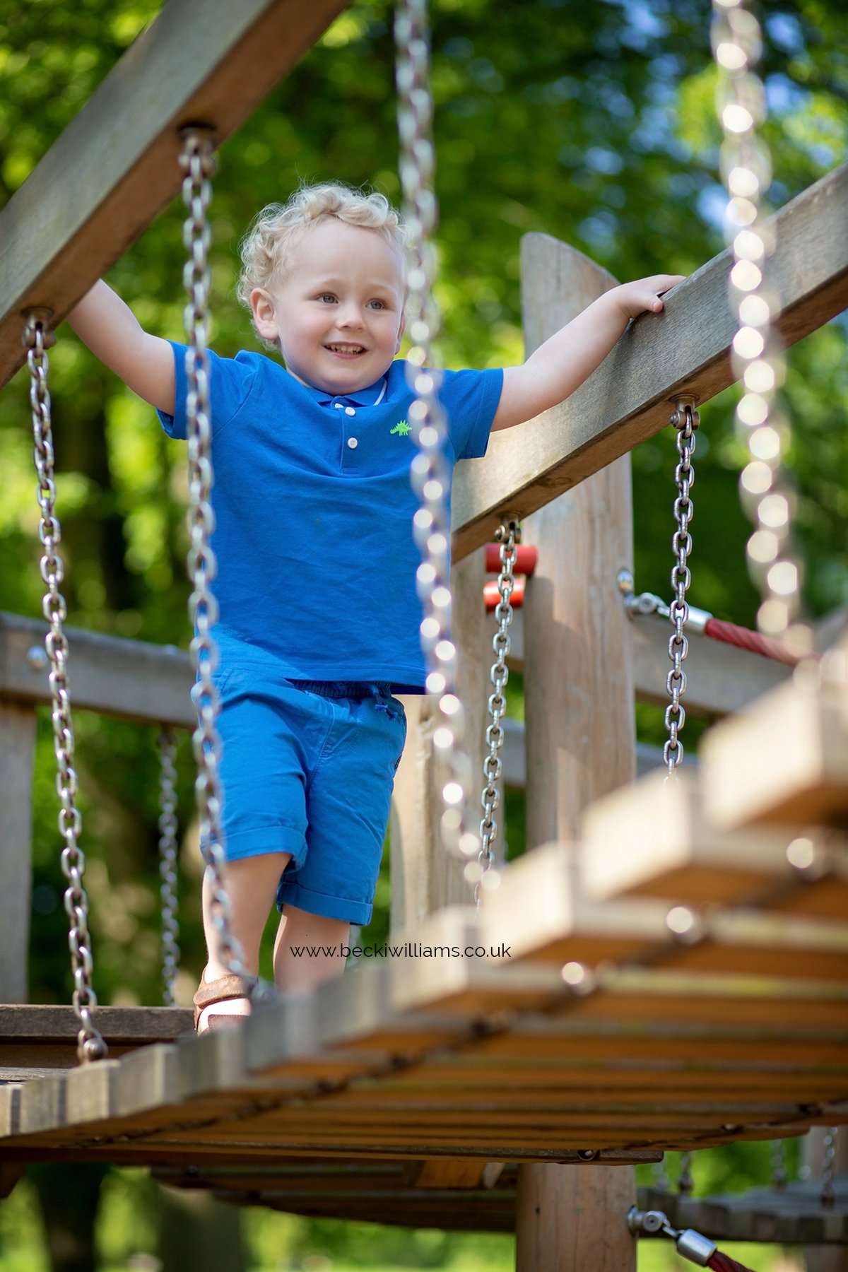 Young boy on a rope bridge