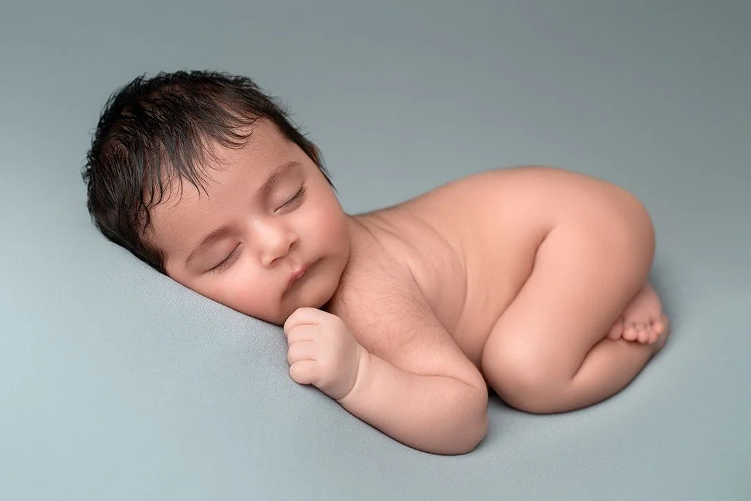 Although you'll hear newborn photographer's say that the best time to photograph a newborn is 1 - 2 weeks, I will happily photograph a baby at any age so you never have to worry about missing out. 

Some five/six week olds are wide awake and others a