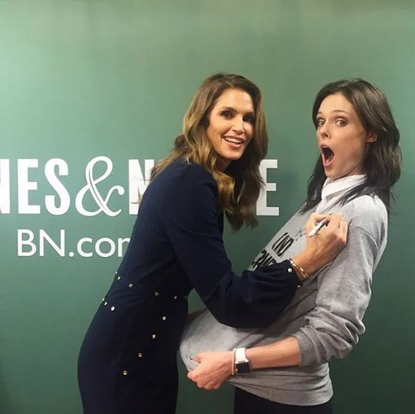 I've been signing books all day, but my friend @cocorocha asked me to sign her @reformation sweatshirt instead #BecomingCindy. Photo @cindycrawford instagram