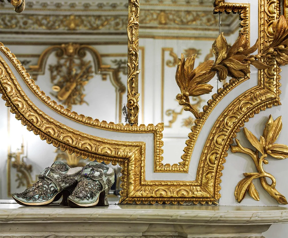 Pale-blue shoes, photographed on the mantelpiece in The Norfolk House Music Room, the British Galleries at the V&A, London, 2014 Silk satin with silver lace and braid England, 1750s V&A: T.70+A—1947; M.48+A—1962 (diamond and sapphire buckles. © Victoria and Albert Museum, London