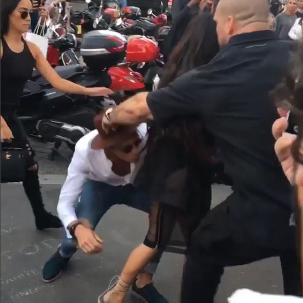 Kim Kardashian Gets a smooch on a bum by Vitaliy Siduk and she is not happy about it!