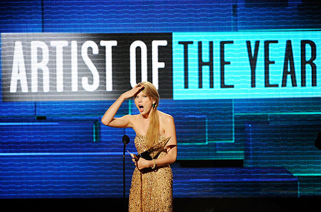 Taylor Swift in 2011 Taylor Swift gives her signature surprised expression after winning a trophy at the 2011 American Music Awards.