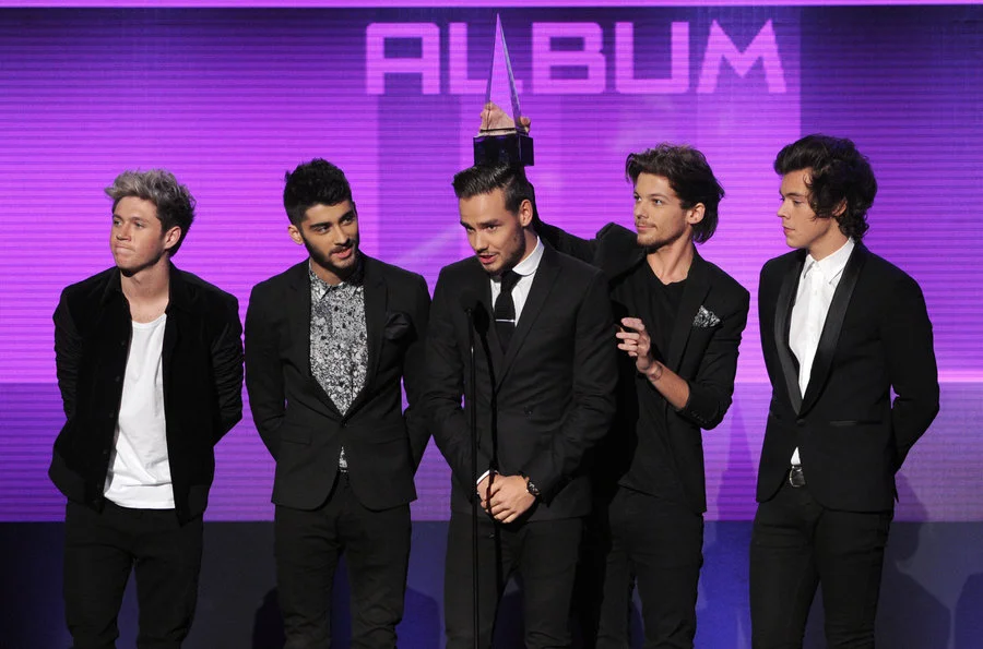 One Direction in 2013 One Direction accept the Favorite Pop/Rock Album award for 'Take Me Home' onstage during the 2013 American Music Awards at Nokia Theatre L.A. Live. November 24, 2013 in Los Angeles, California.
