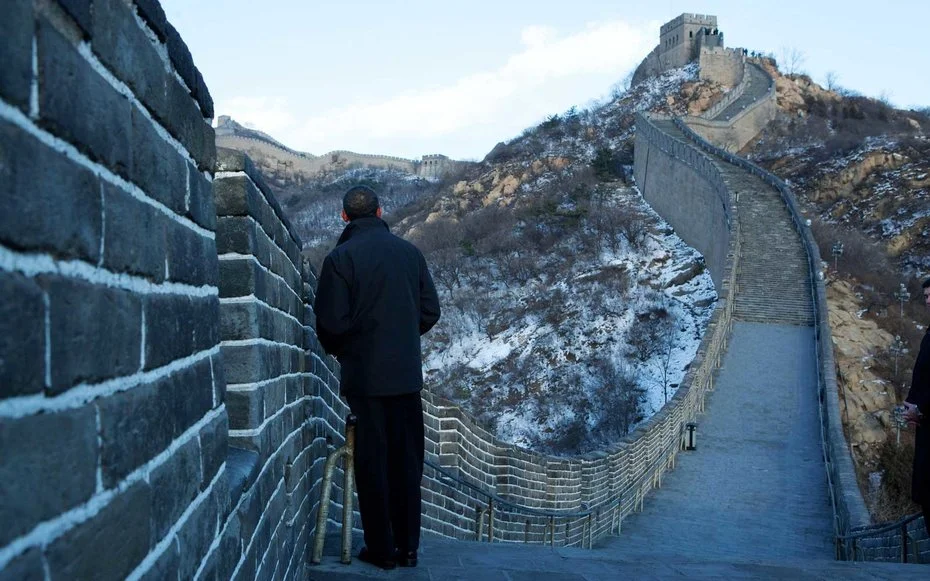 The Great Wall of China Obama takes in the Chinese countryside in a rare quiet moment on The Great Wall of China.