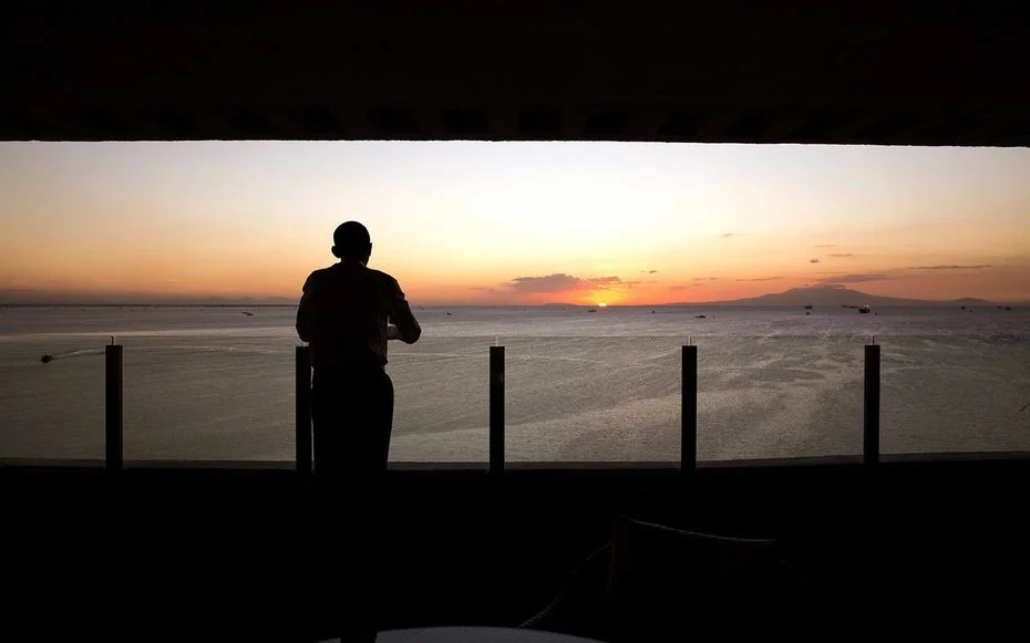 Manila Bay, Philippines Obama takes a moment to appreciate the stunning scene that is a sunset in Manila Bay.