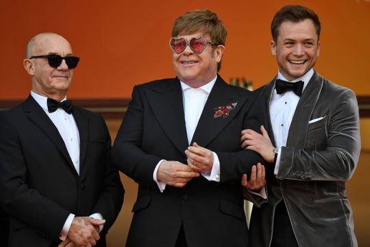 Songwriter Bernie Taupin, Elton John and Taron Egerton pose as they arrive for the screening of the film "Rocketman" at the 72nd edition of the Cannes Film Festival in Cannes. (Photo: CHRISTOPHE SIMON, AFP/Getty Images)