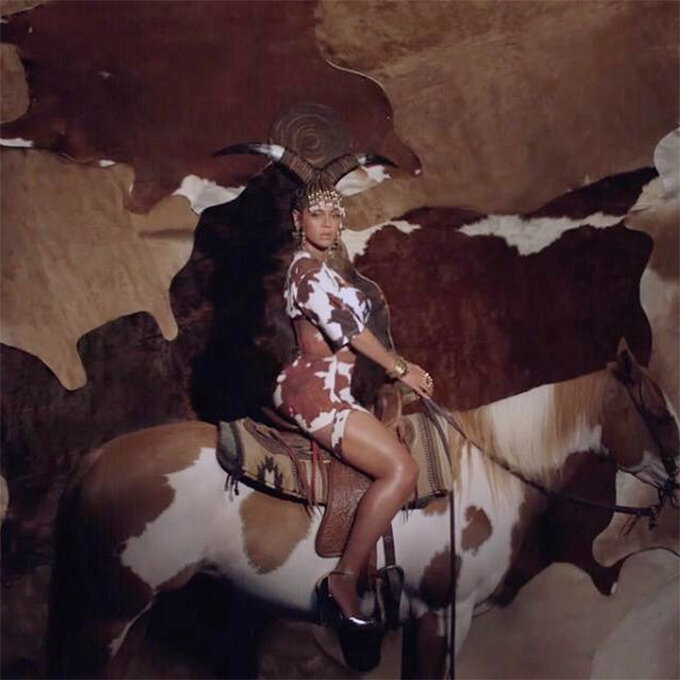 Top and bottom with cow print by Riccardo Tisci. This suit was first presented at his debut collection for Burberry.