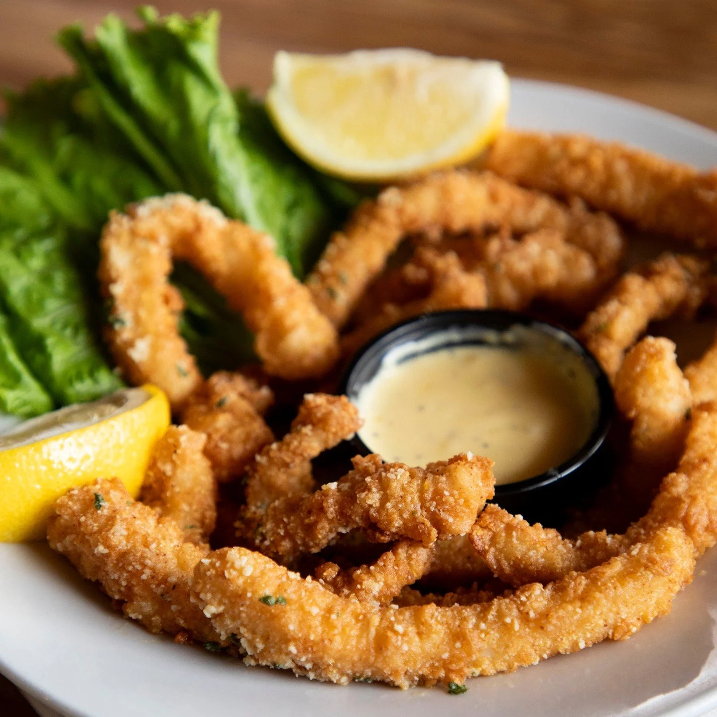 Crispy, golden, and made for sharing... but we won&rsquo;t judge if you don&rsquo;t. 

Our crispy calamari is served up hot with fresh lemon and the perfect dipping sauce. The kind of appetizer that disappears FAST.

Come hungry!