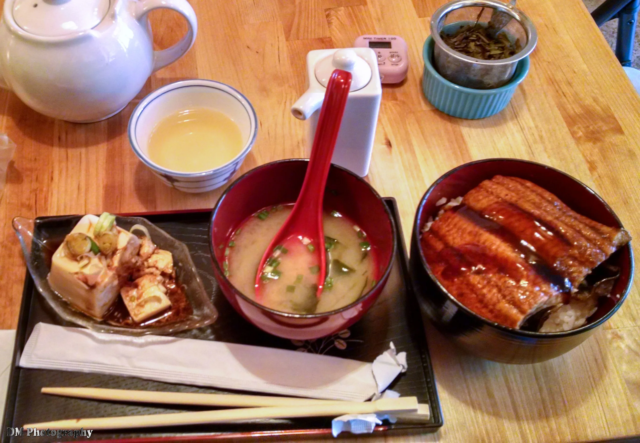 A picture that I had taken with my cell phone back in January of the Unagi Donbori with Peach Blossom tea, miso soup, and a block of tofu.