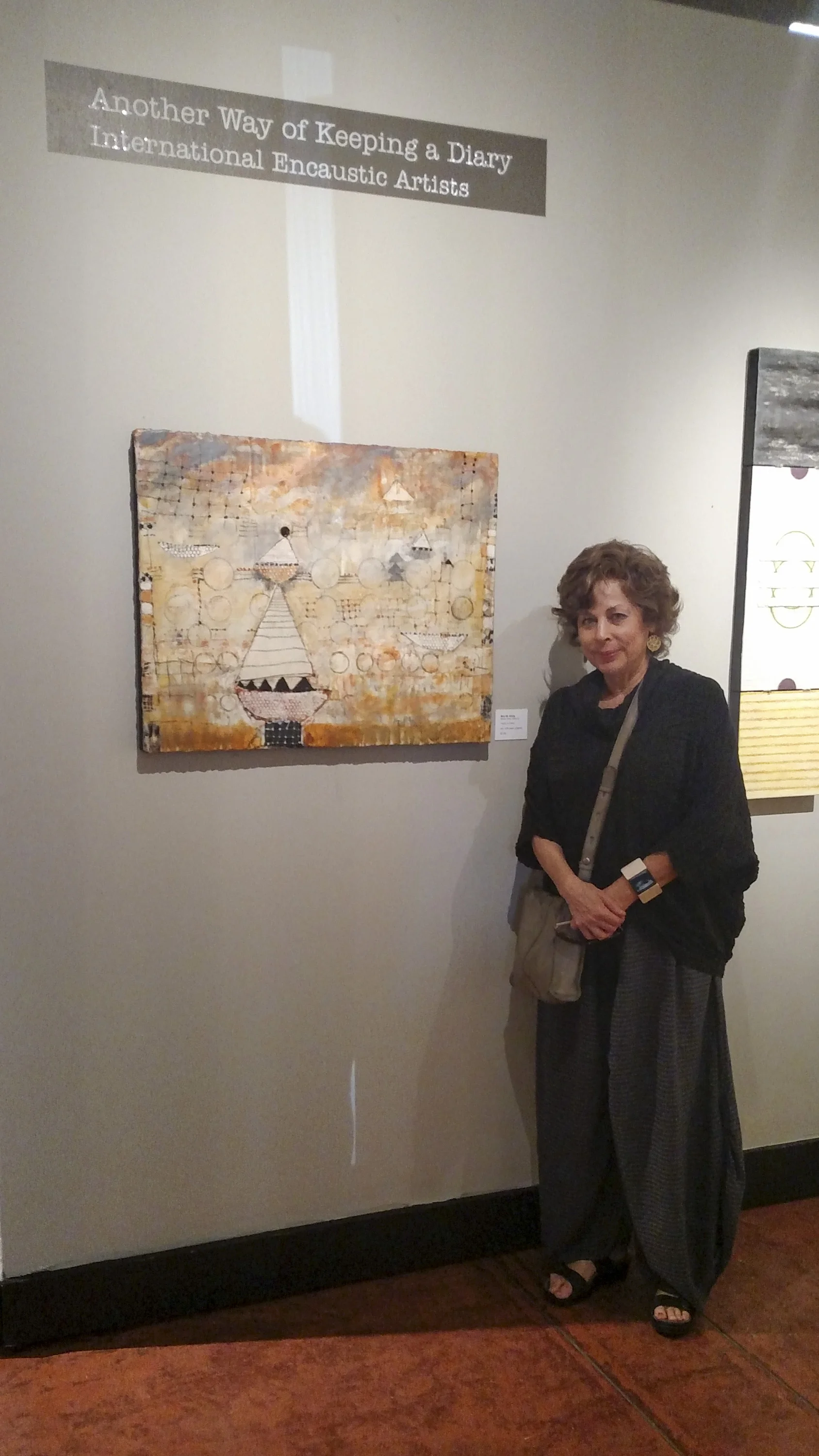 Mira M. White , next to her piece in the show...