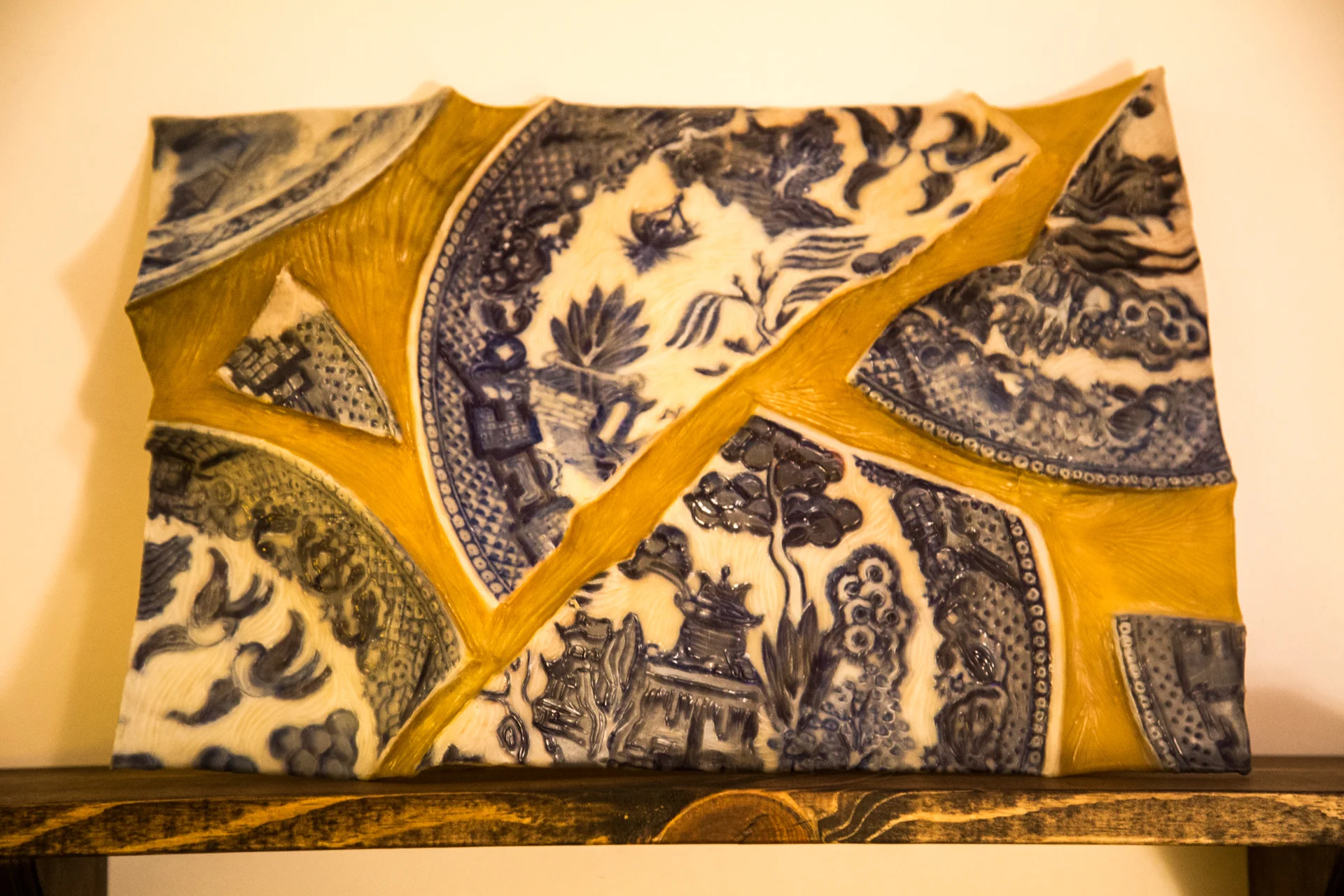 "Fragments of Home" (Mama, 1933-2016), 2016, (18 x 24 x 5 inches), (kozo paper, photograph, beeswax, carved and sculpted, hand-colored with powdered pigment, and resting on plate rail)