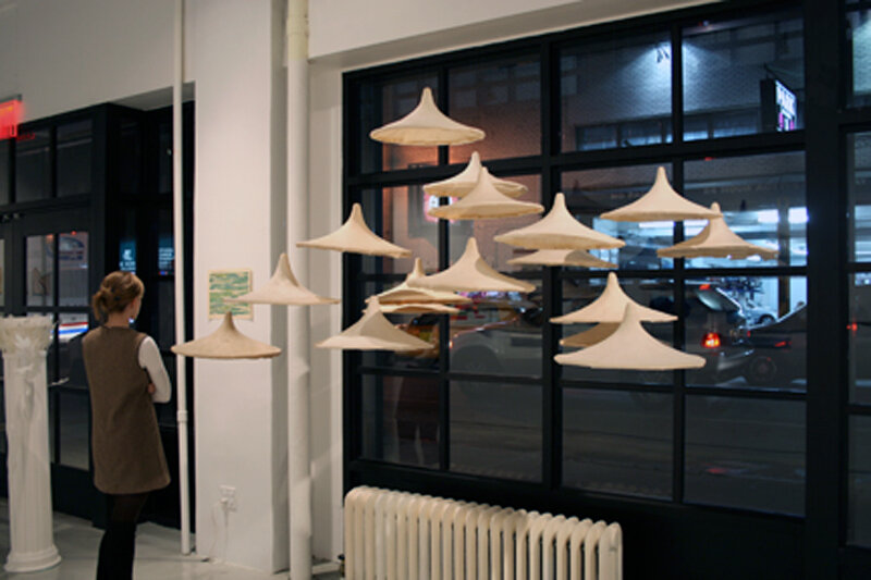   Wennie Huang   Between Heave and Earth (Installation view) , 2003 Cast abaca paper with methyl cellulose 14 1/2 x 14 1/2 x 7 Inches (inside rim; each hat) 