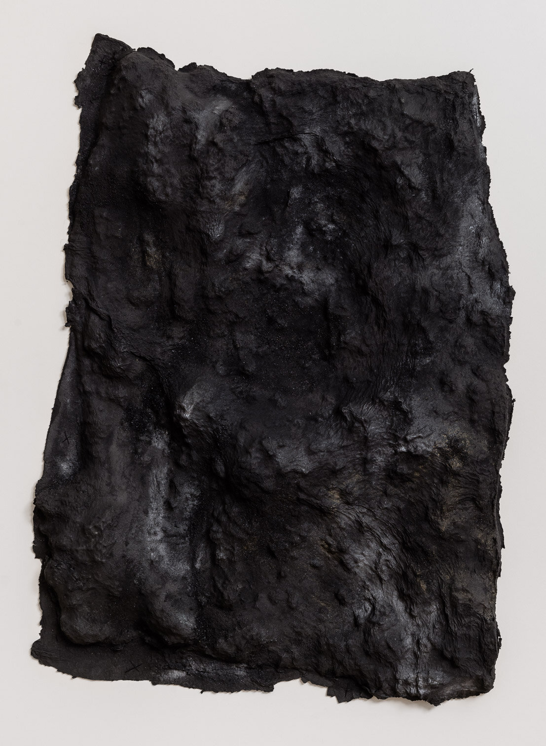   Blane De St. Croix   Lava Bed, Kilauea 1 , 2015. Paper and metal powders. 43 x 31 x 3 inches. Image credit: Etienne Frossard. 