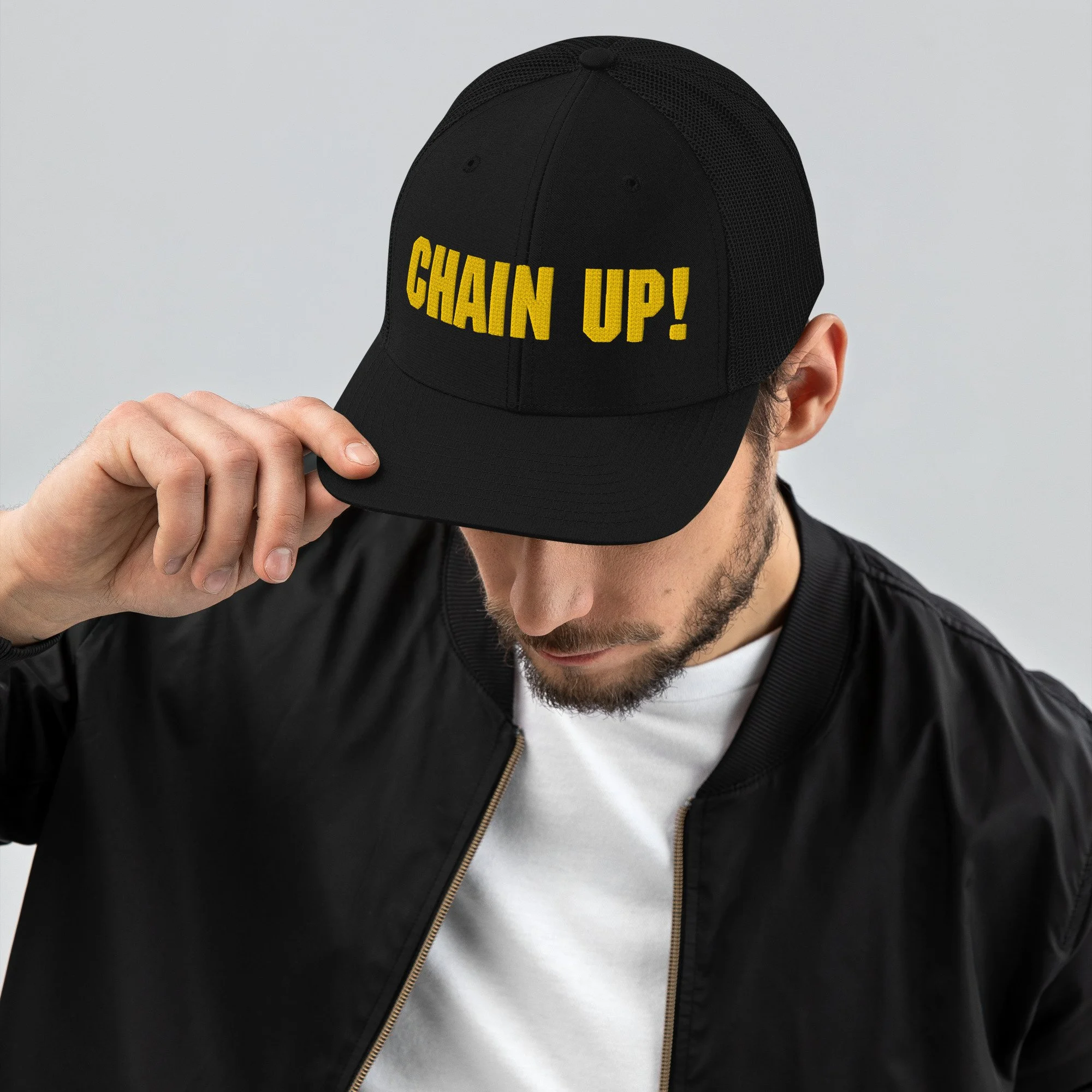 snapback-trucker-cap-black-front-62a39fa162309.jpg
