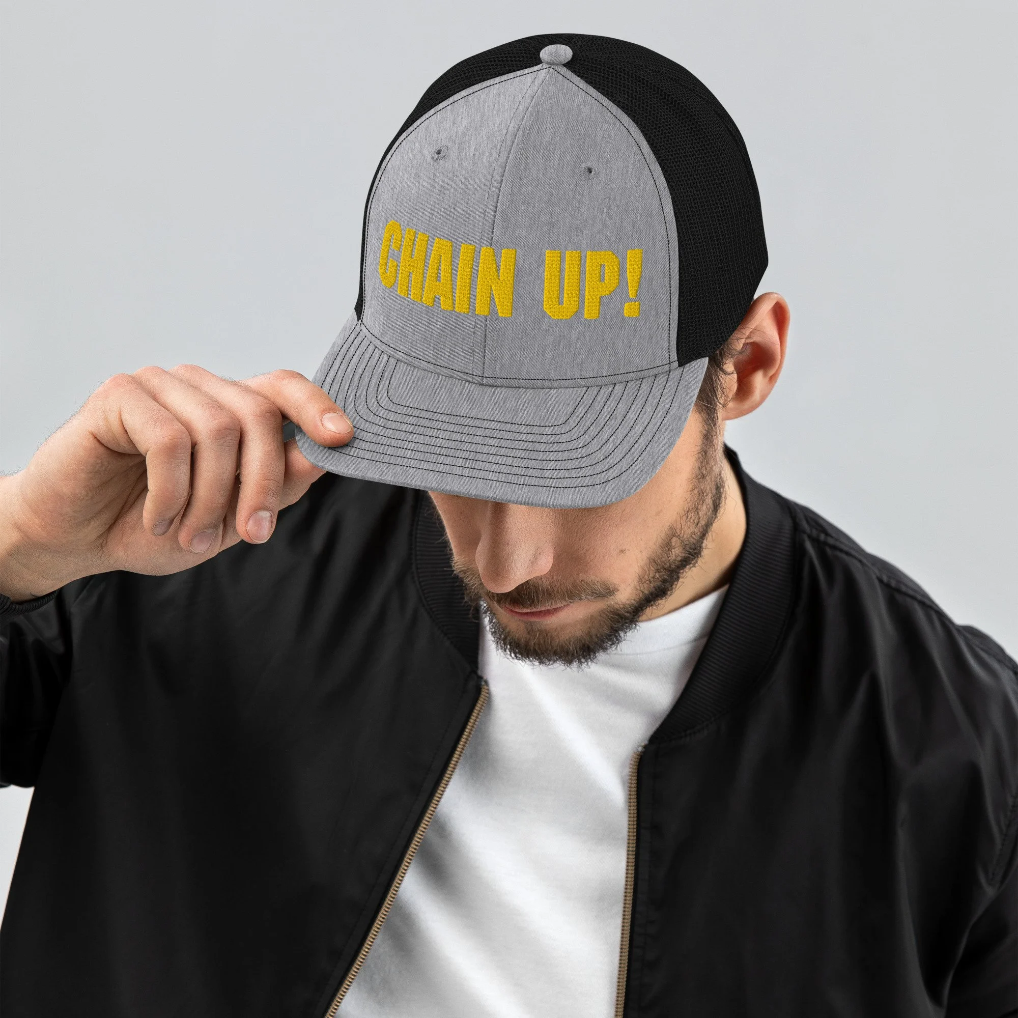 snapback-trucker-cap-heather-grey-black-front-62a39fa162996.jpg