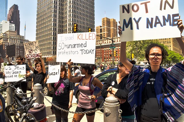  Jewish Voice for Peace rabbinical council member May Ye joins with dozens of Philadelphia Jews and allies gathered at the Israeli flag-raising event at City Hall today to call on our elected officials to condemn Israel's indiscriminate killing of ov