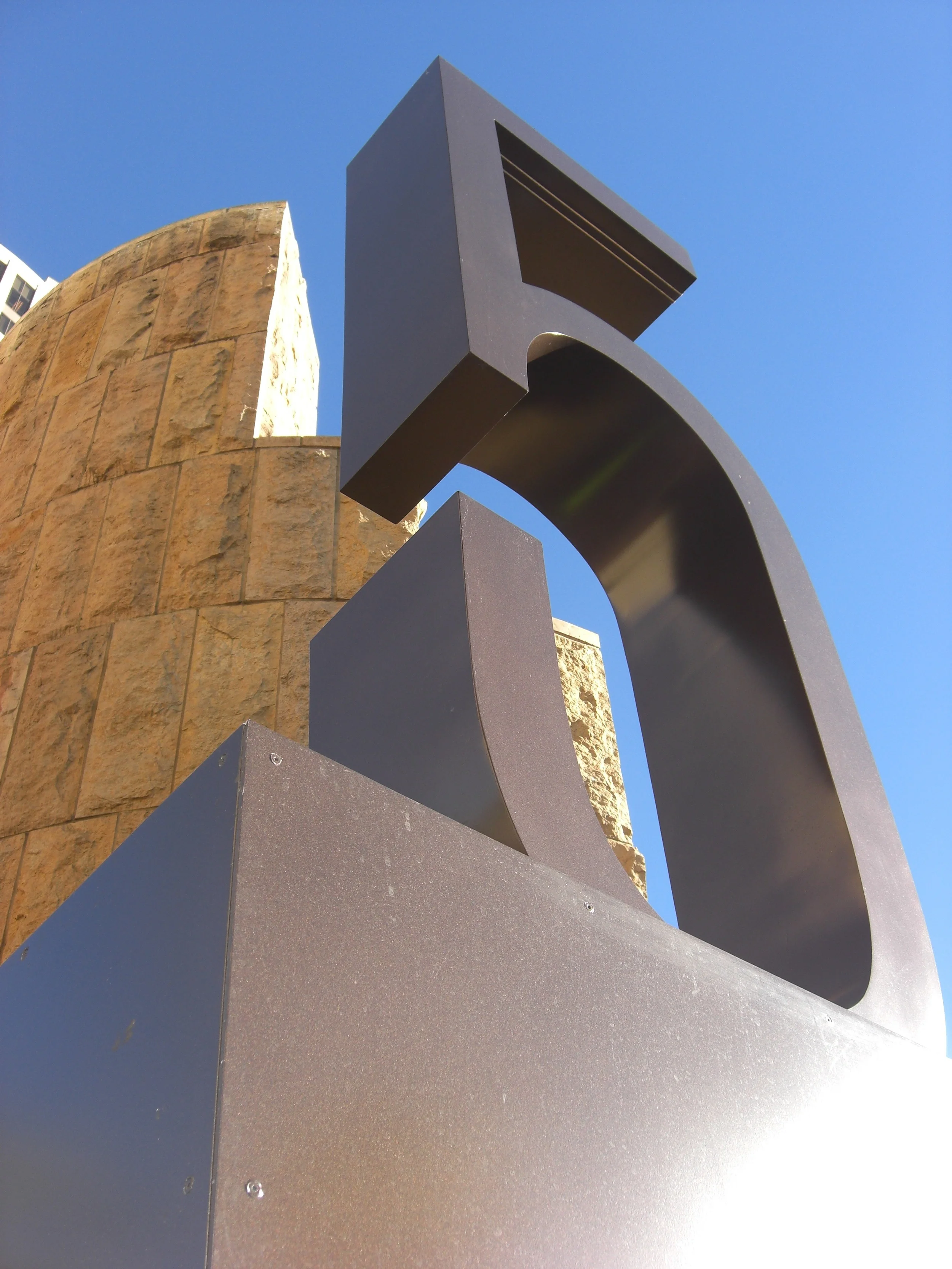  ...fabricated aluminum number with painted finish, closed backs and no visible seams, secured to top of sign cabinet. 