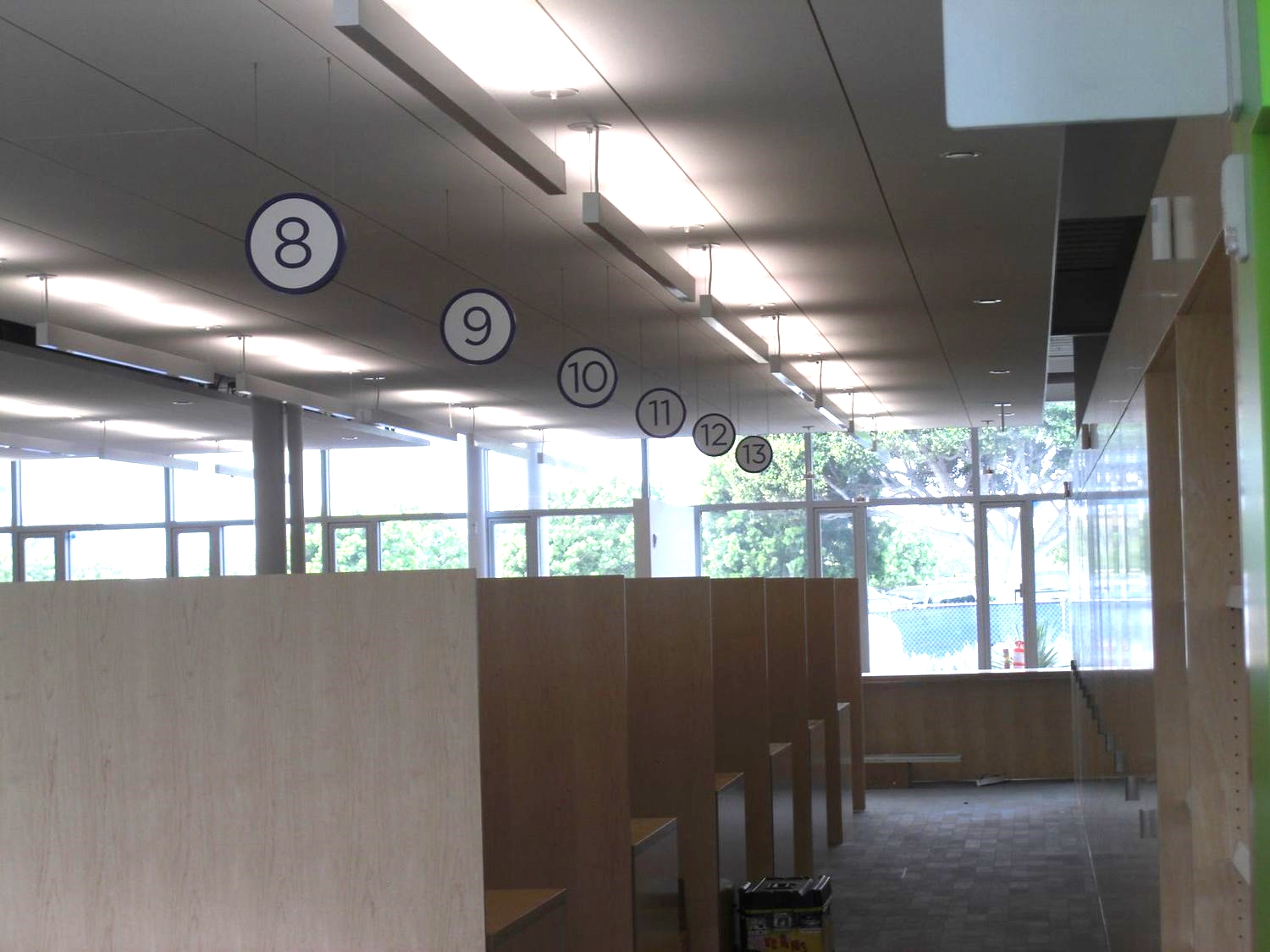  ...hung from acoustic ceiling&nbsp;panels&nbsp;with stainless steel aircraft cable attachments. 