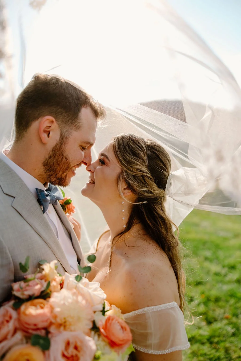 New Hampshire Wedding Portrait under a veil with flowers between them