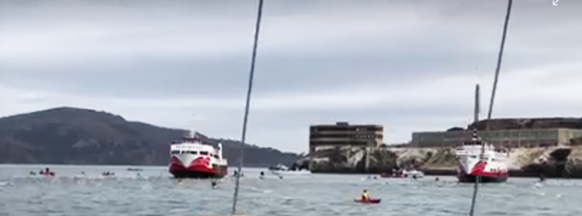 Swimmers share packed, loaded-to-capacity commercial ferry ride to Alcatraz, leap in orderly fashion from huge SF Bay harbor ships, then power through choppy Pacific Ocean currents to Aquatic Park at Hyde Street Pier.