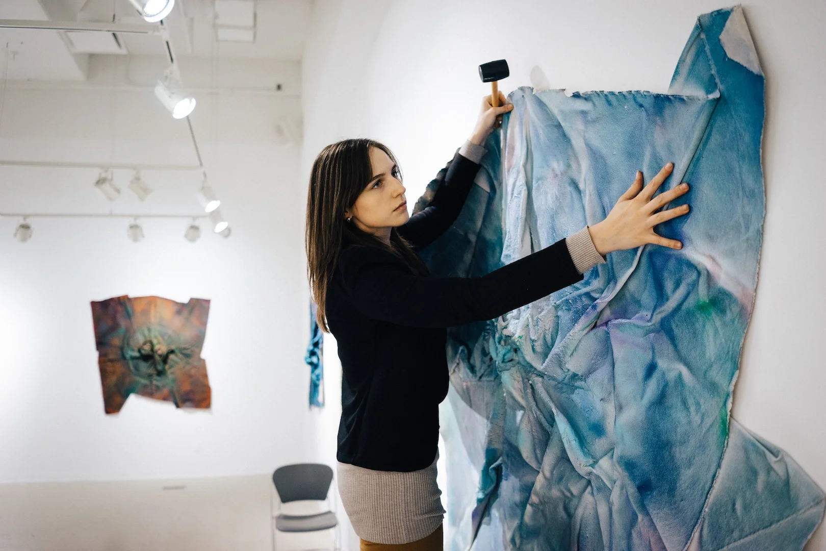 Emanuel Ciobanica at work, installing the series in the Gales Gallery.