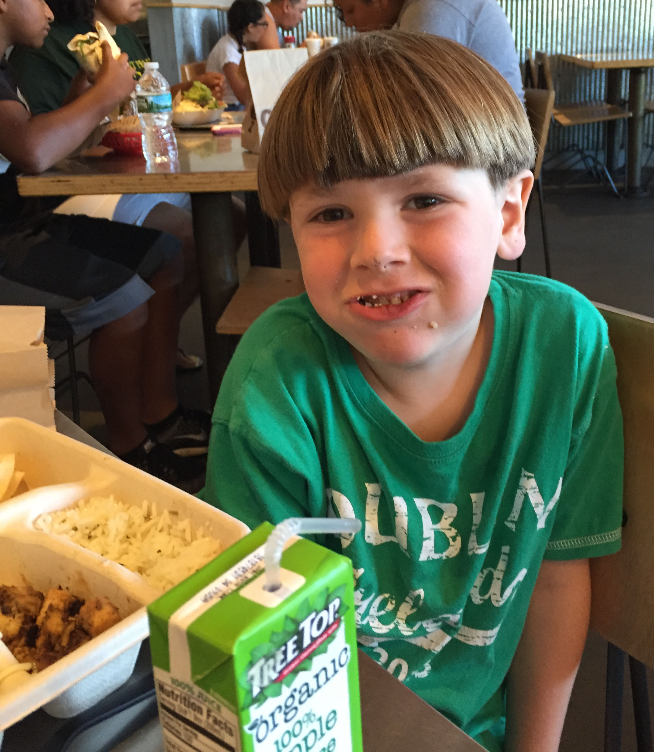 Here he is at Chipotle enjoying his free meal. This was his first time at Chipotle, and he says that he liked his meal and plans to go back. AOK--he has more gift certificates!