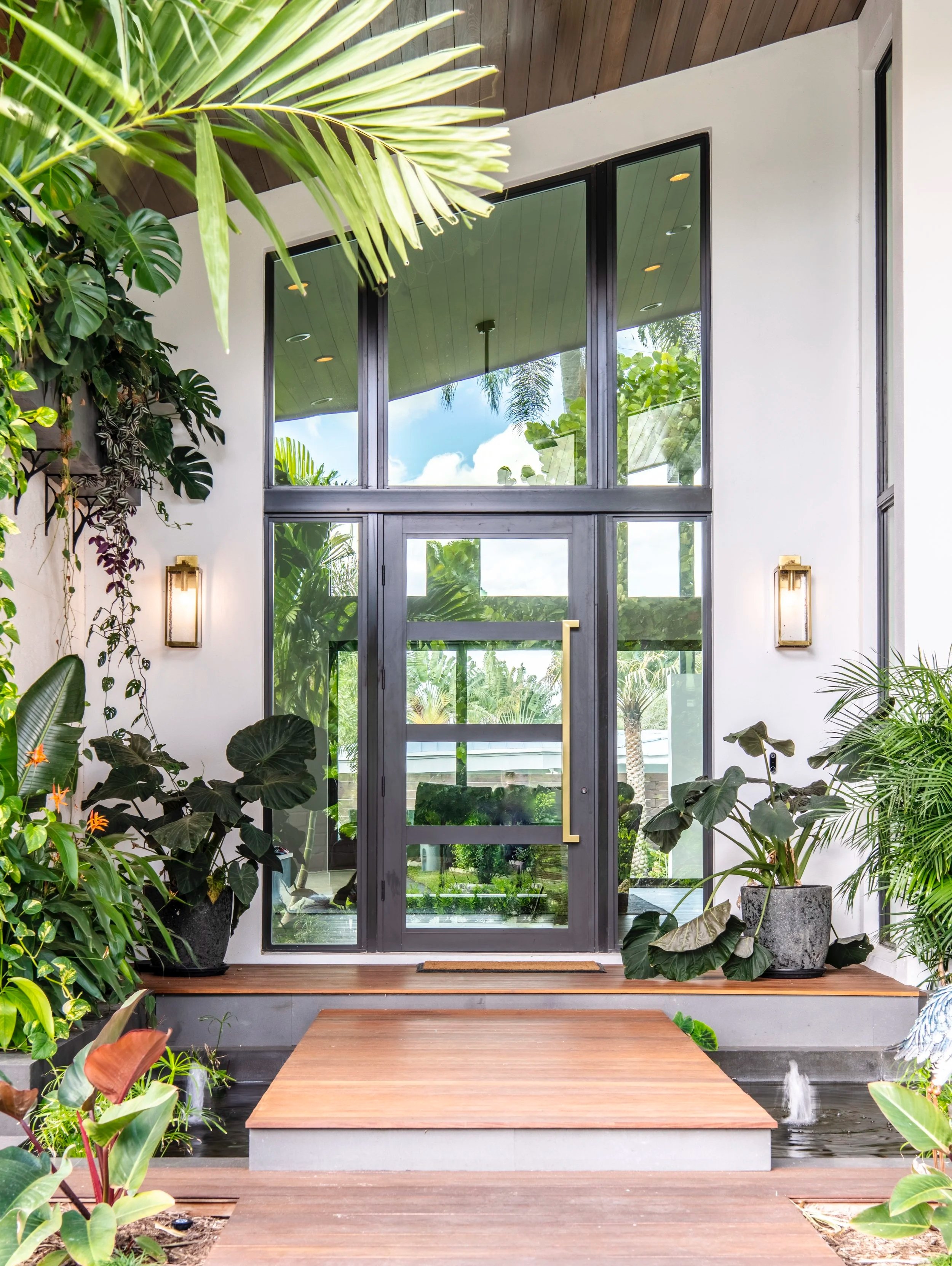 high end residential exterior with natural stone and wood elements