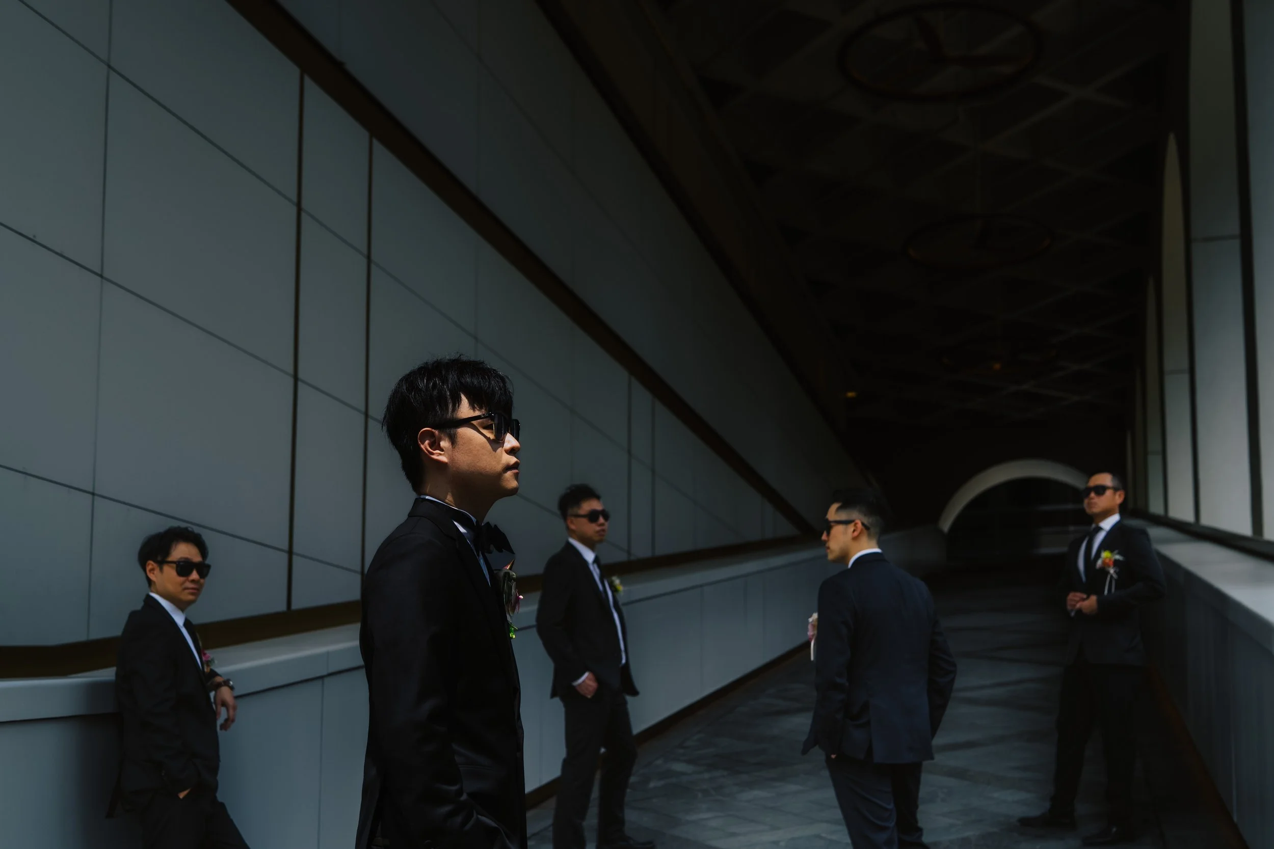 Cinematic groom and groomsmen portrait at The Murray Hong Kong wedding in Admiralty.