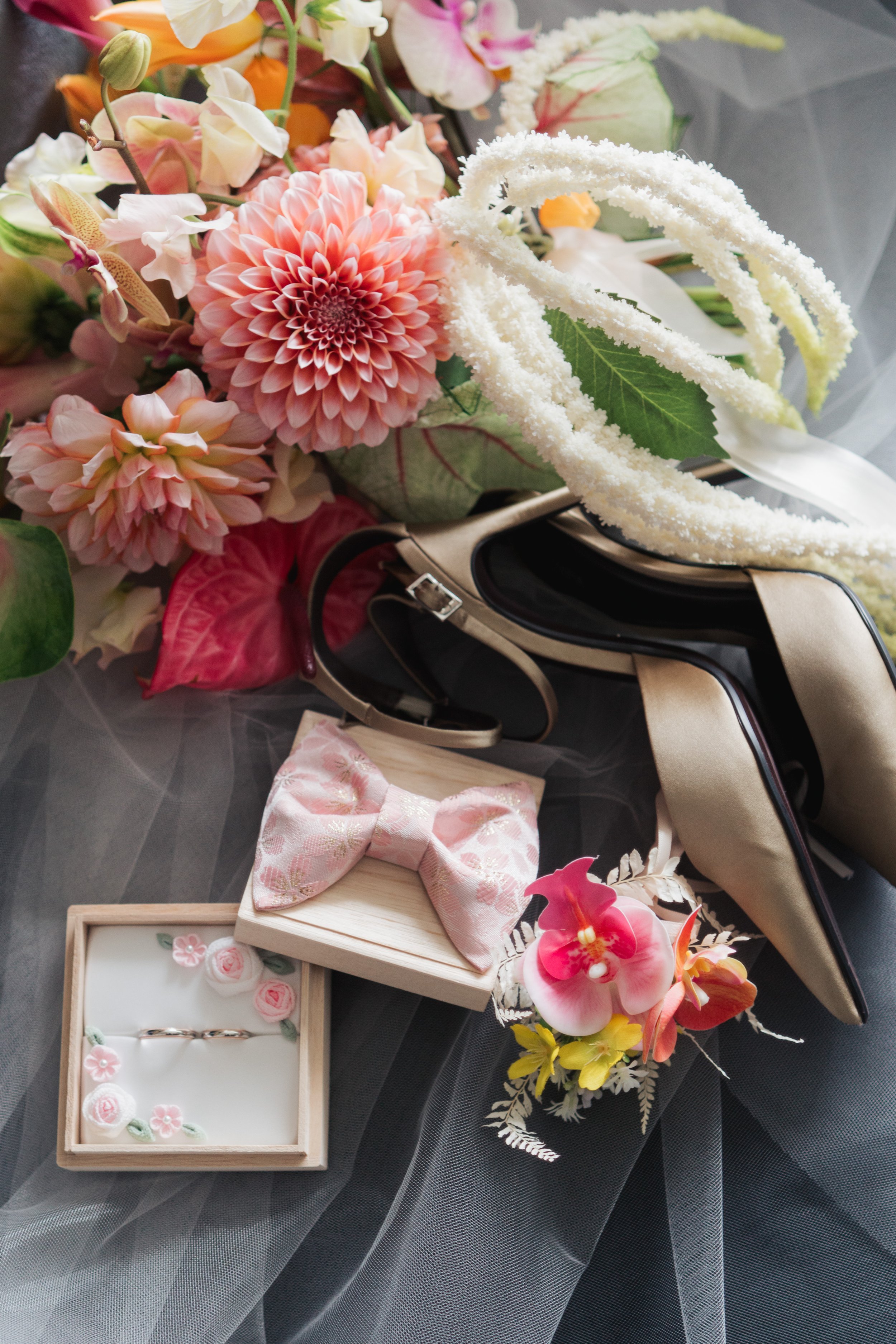 Wedding rings, silk shoes and floral details during bridal preparations at The Murray Hong Kong.