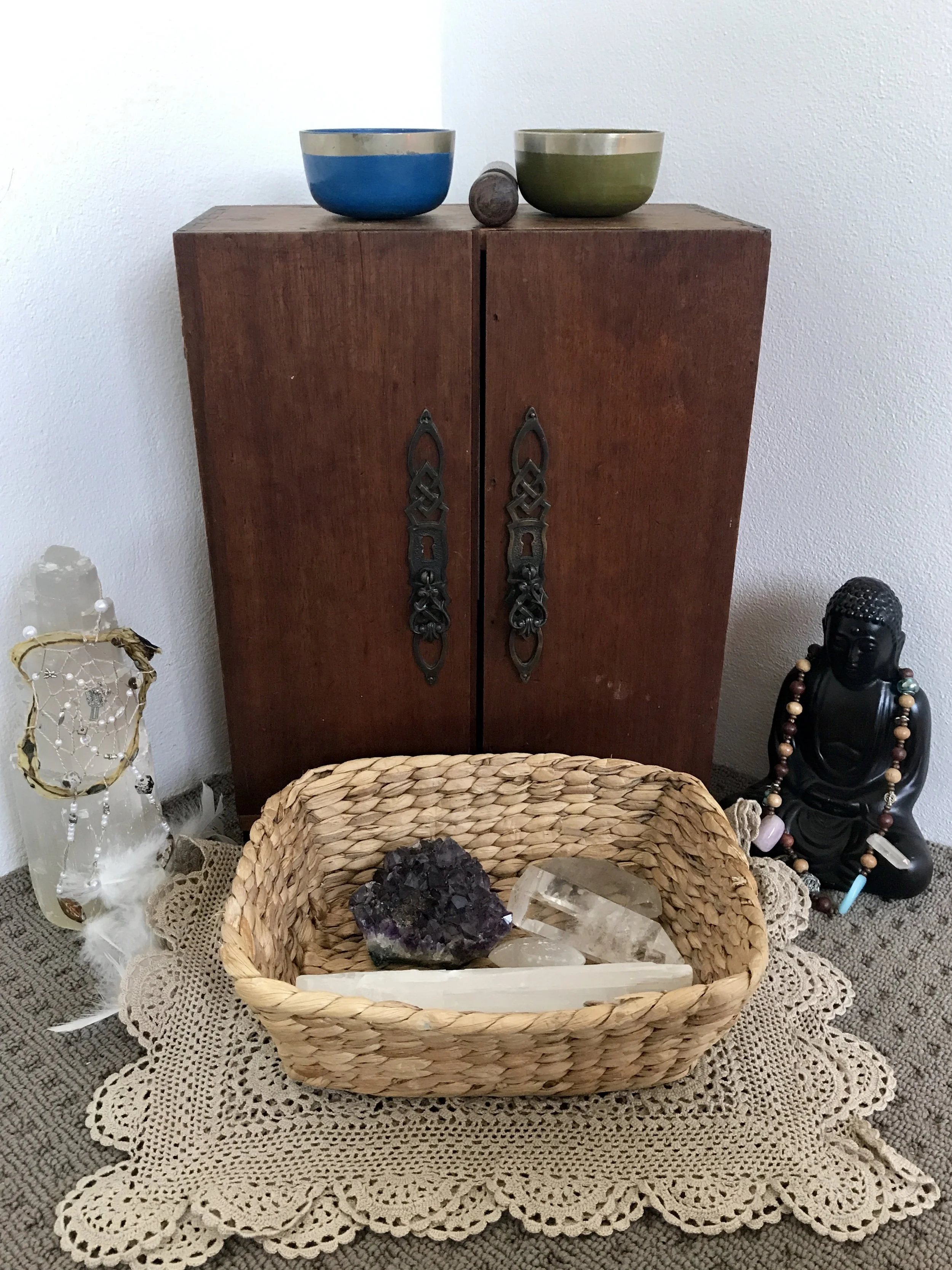 Our Buddha on the right, wearing the Birthing Necklace my soul sisters made for me at my Blessingway - and our Umbilical Chord Dreamcatcher hanging on our Selenite Crystal on the left.