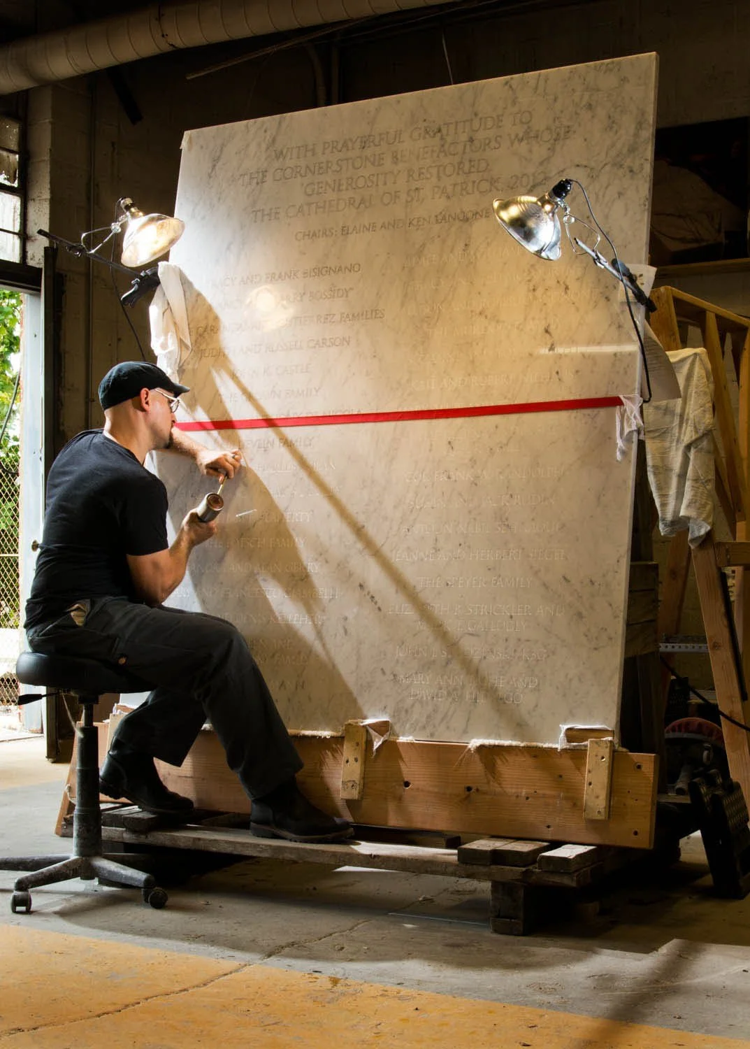 hilgartner sebastian working on gratitude stone.jpg