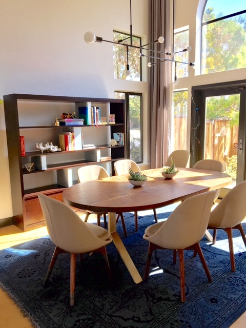 "I like this bookshelf and dining table from a project in Alameda. The bookshelf has contrast dividers that we painted in a custom color. The dining table is a racetrack walnut surface on brass legs." --Taylor