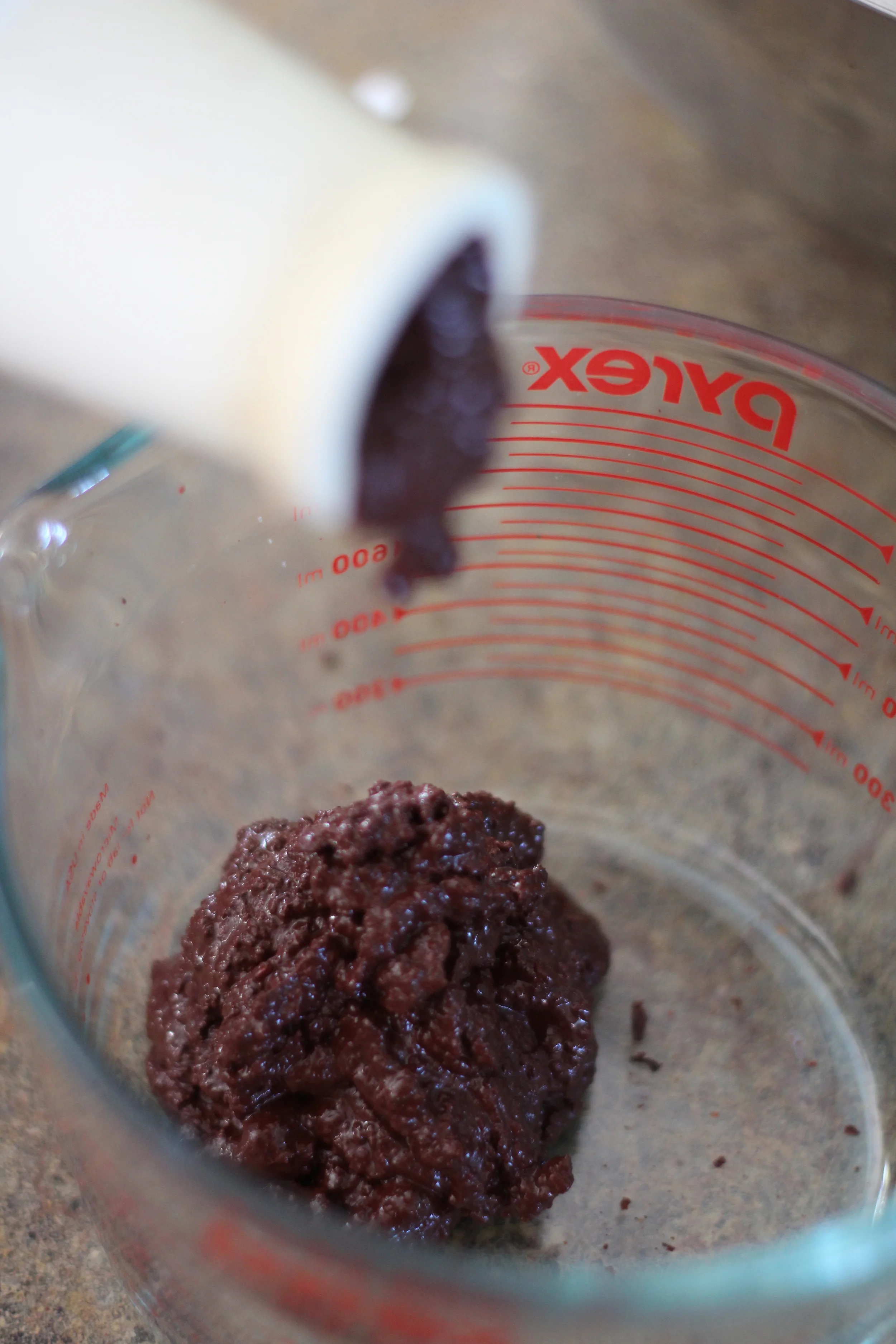 ground nibs, aka chocolate liquor, fresh out of the grinder-juicer