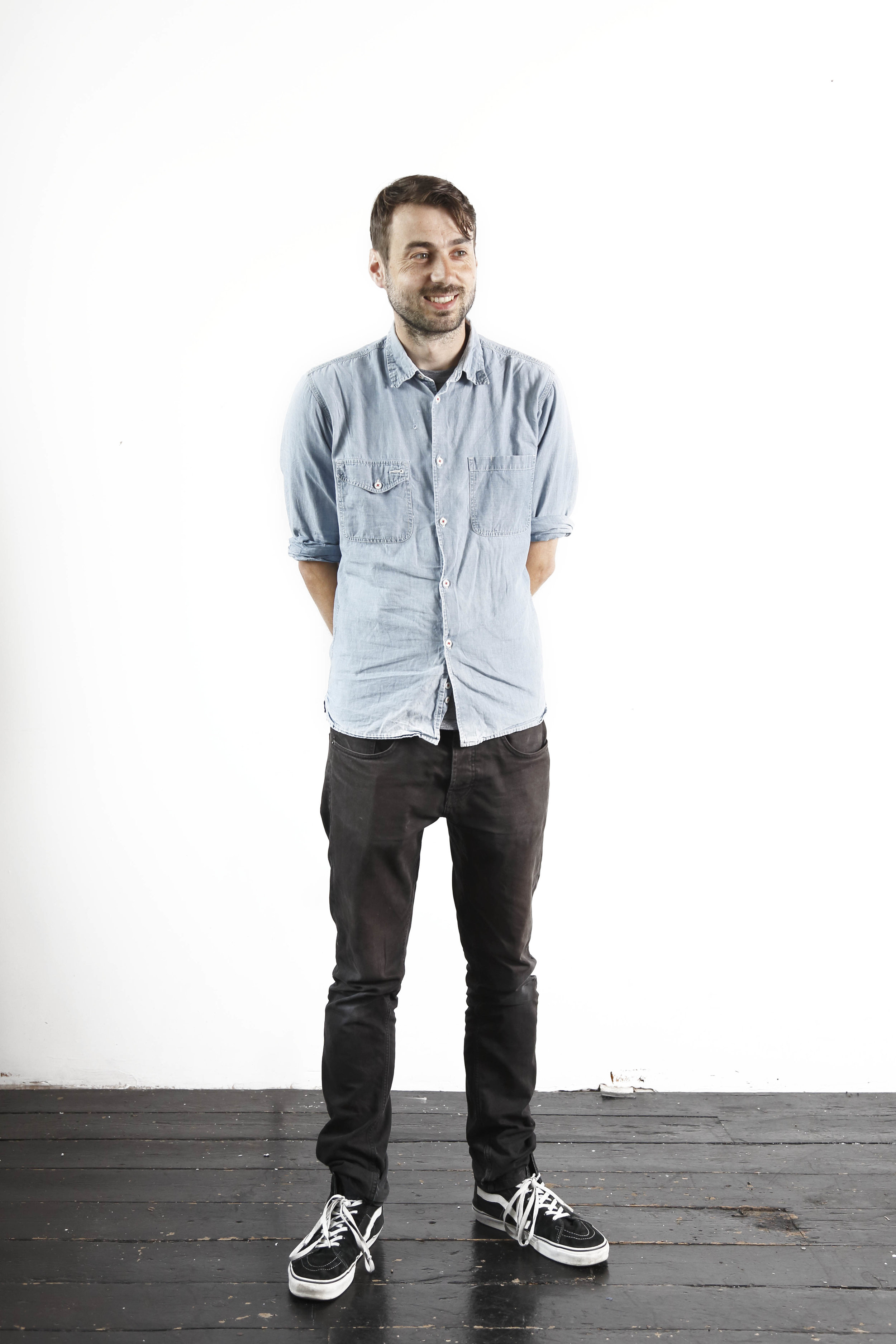 Here's a picture of me standing awkwardly in front of a white wall a couple of years ago. I look a bit older now.