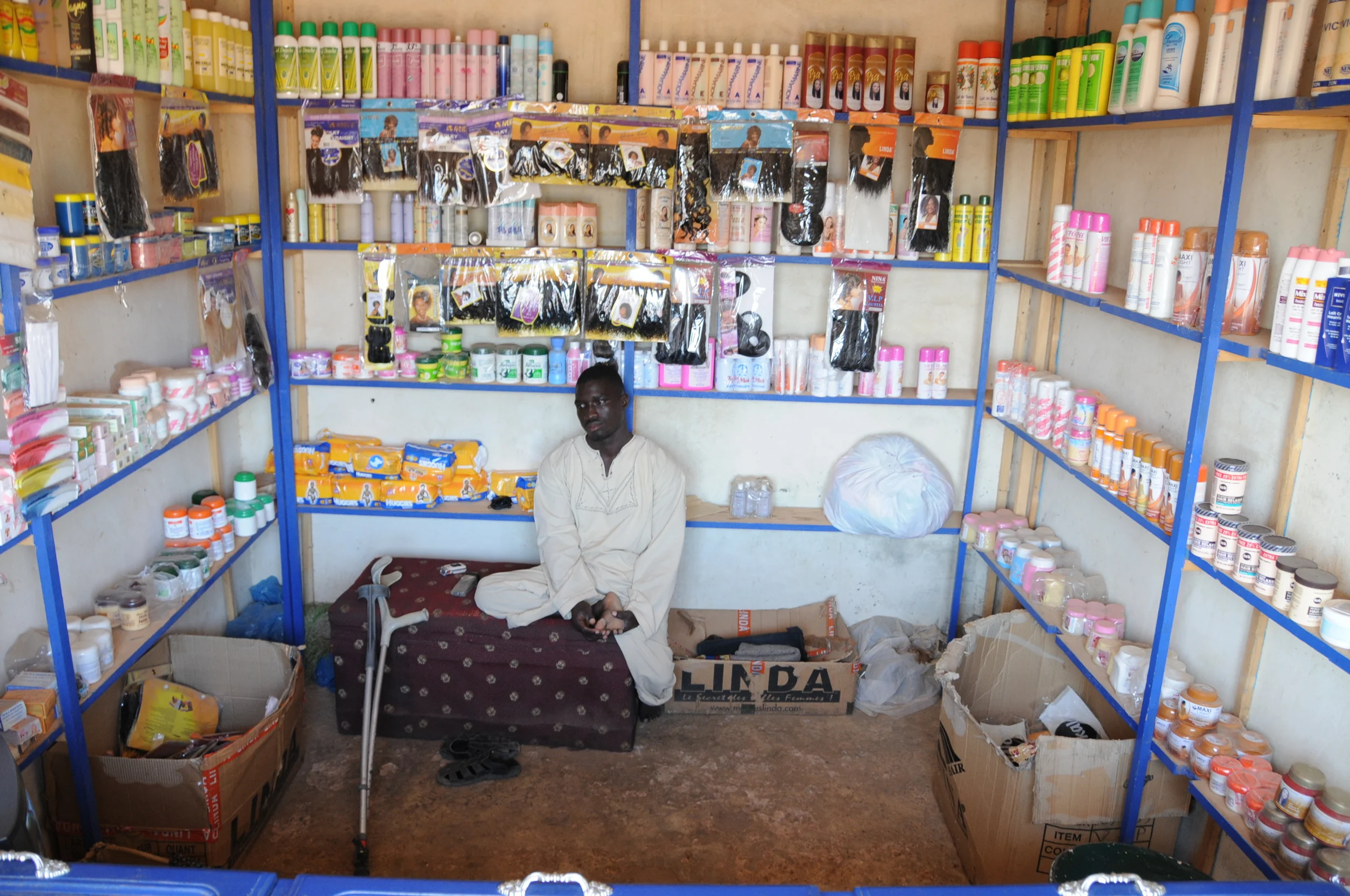 Each day, Faye leaves his home early in the morning to go to work at a store that sells beauty products. Faye went to school for three years, before he had to drop out, because he did not have enough money to finish. 