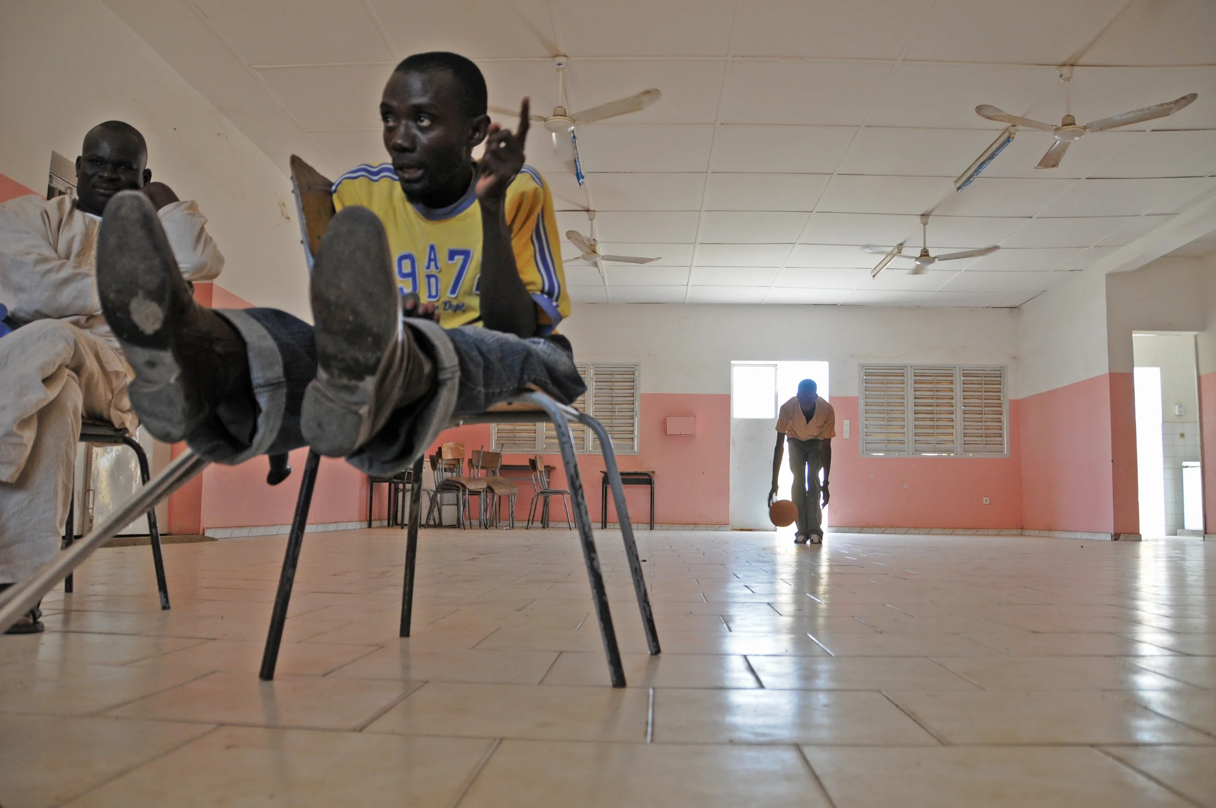  While they wait for the bus to pick them up and take them to their first game, the coach lays out the team’s strategy. 