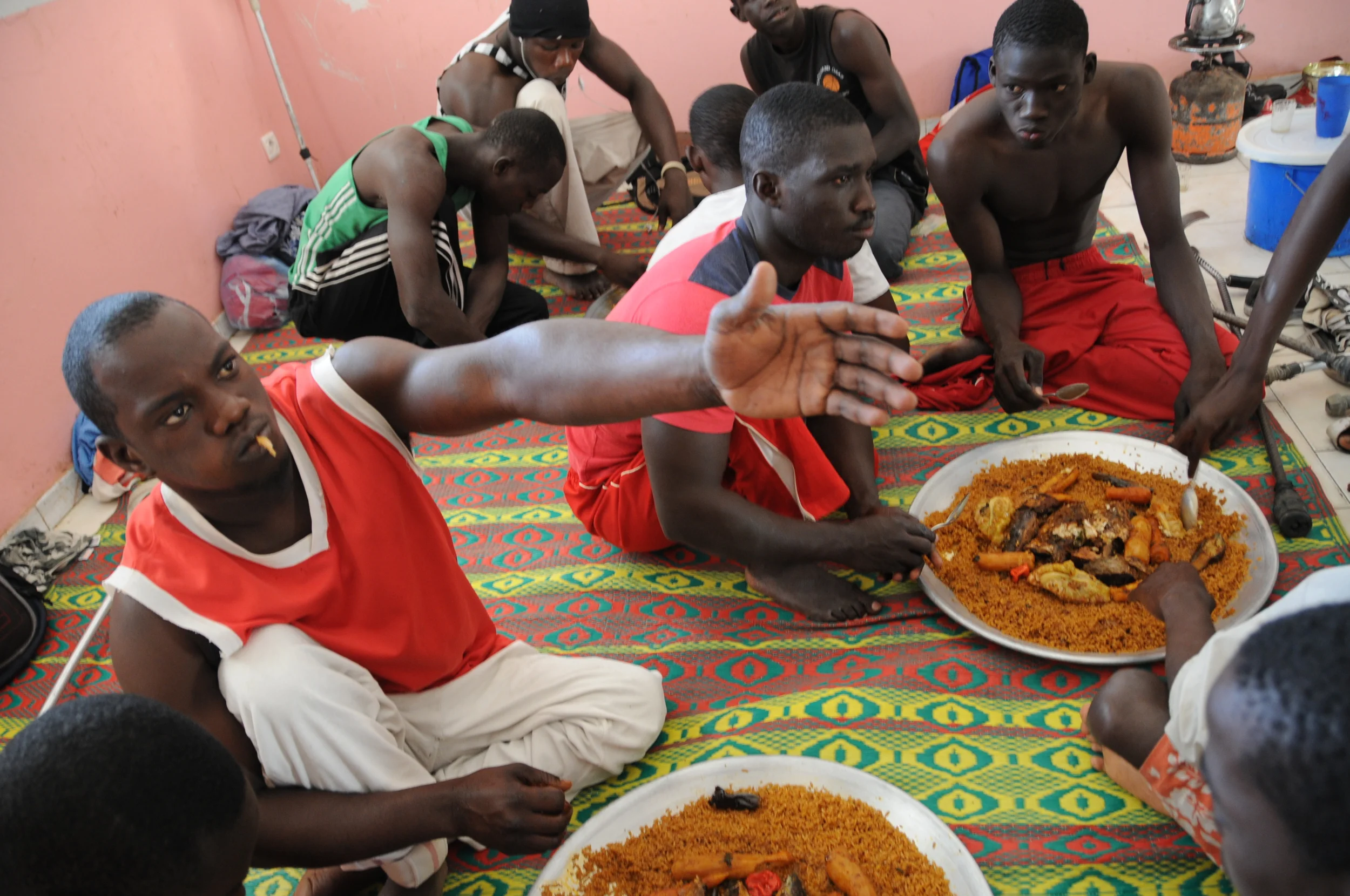  During their wait time, the team eats a traditional Senegalese lunch of rice, fish and vegetables before the game. 