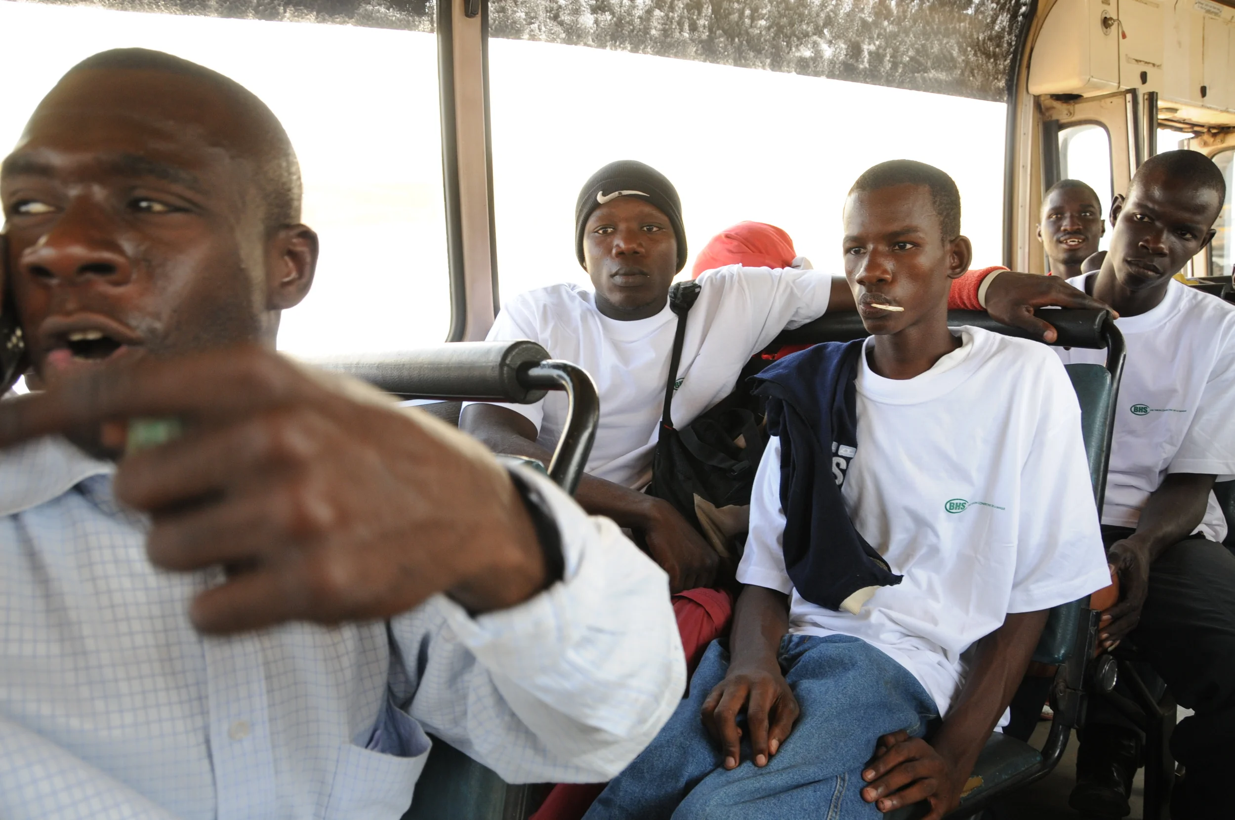  After the bus finally arrives, the players are running late for the game. A team manager yells out instructions to the driver as he calls the other team to tell them they will be late to the game. But the bus was too late, and the Talibou Dabo team 
