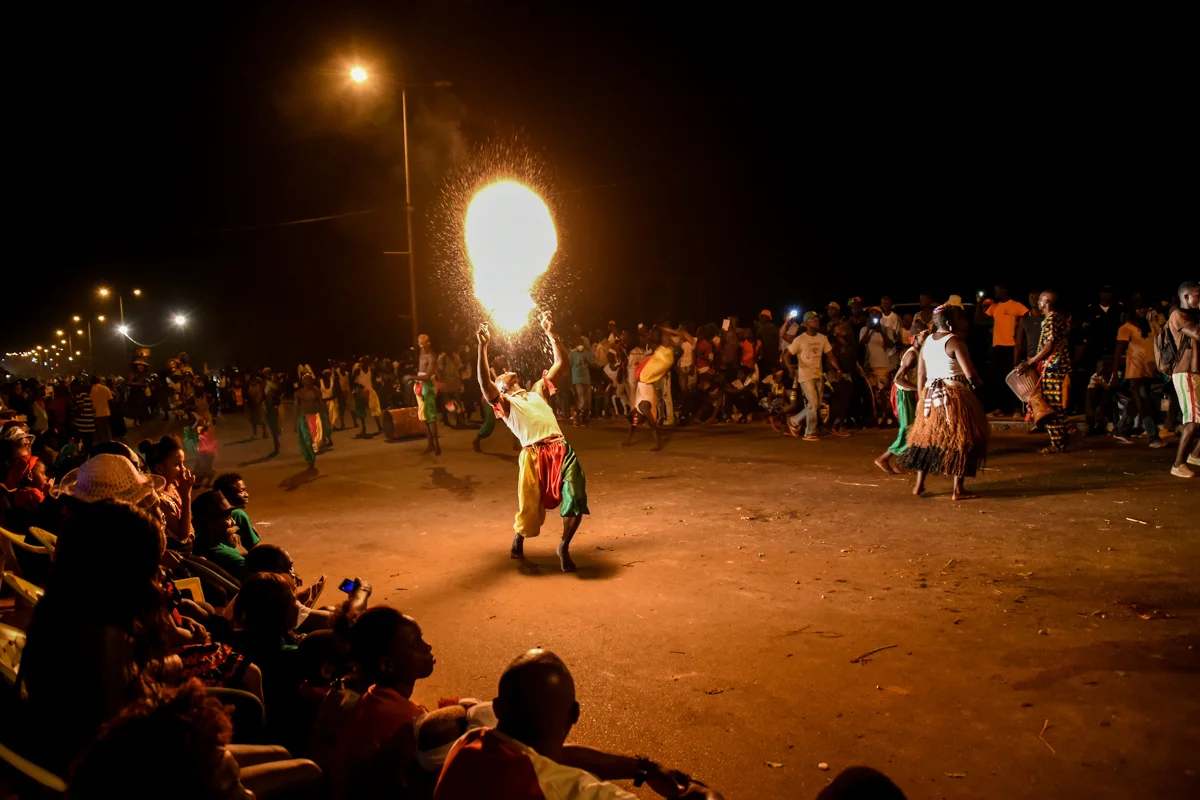 Bisssau, Guinea Bissau (February 9, 2016) - A man dressed as a traditional Fula entertainer breathes fire at Guinea Bissau's Carnaval celebrations.
